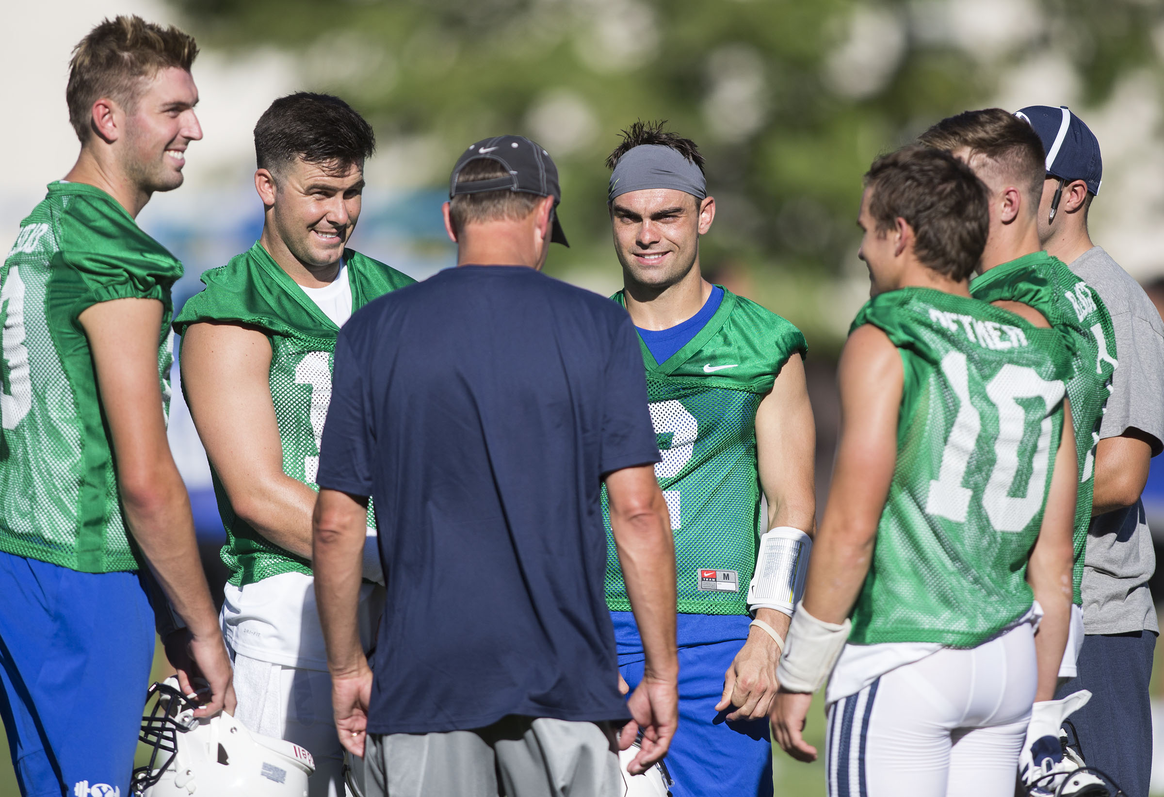BYU offensive coordinator Ty Detmer with quarterbacks (from left) Kody Wilstead, Tanner Mangum, Austin Kafentzis, Koy Detmer Jr., and Beau Hoge during fall camp, July 29, 2017 in Provo, Utah. (Photo: Kelsey Brunner, Deseret News)