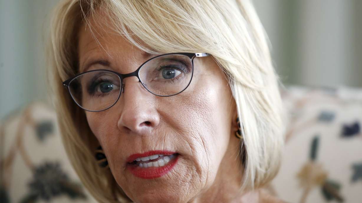 AP Interview: DeVos says she didn't decry racism enough