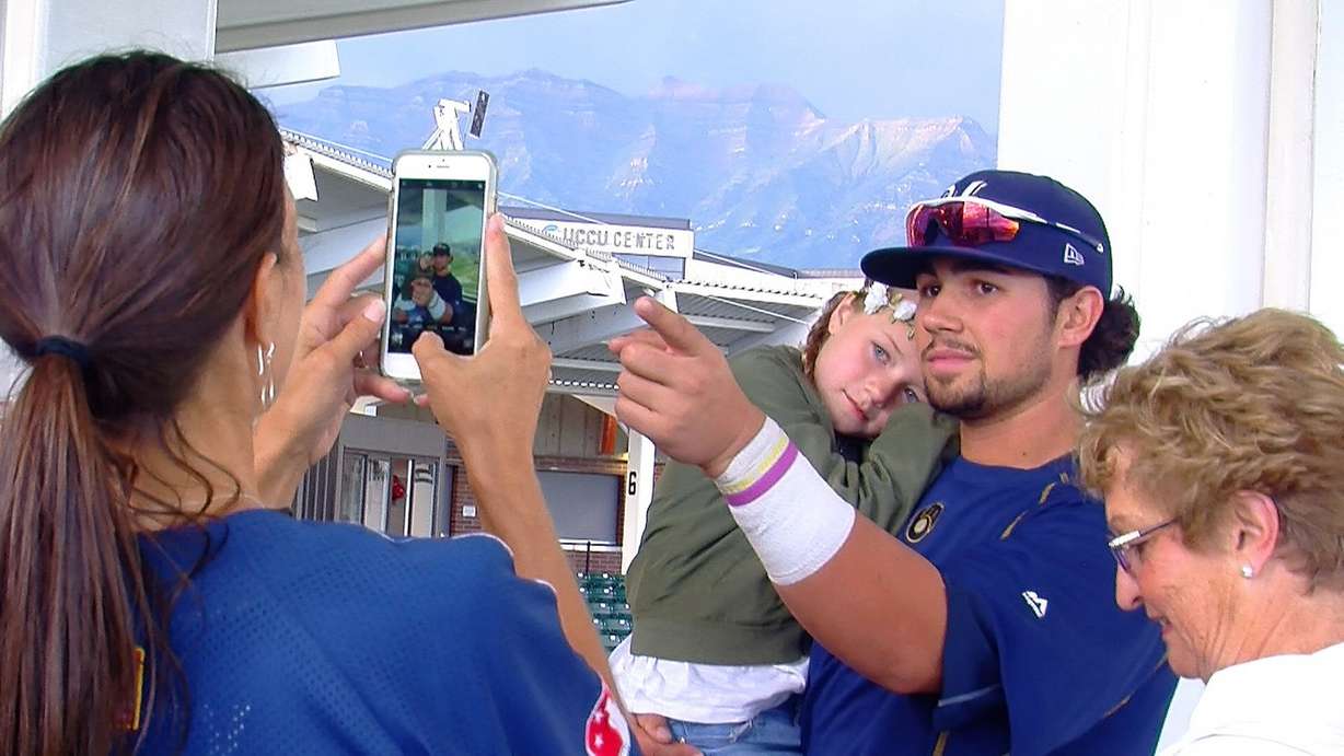 Former Pleasant Grove baseball standout Payton Henry poses for pictures with friends and family during the Helena Brewers' recent Pioneer League roadtrip to the Orem Owlz, Wednesday, Aug. 9, 2017 in Orem. (Photo: Sean Walker, KSL.com)