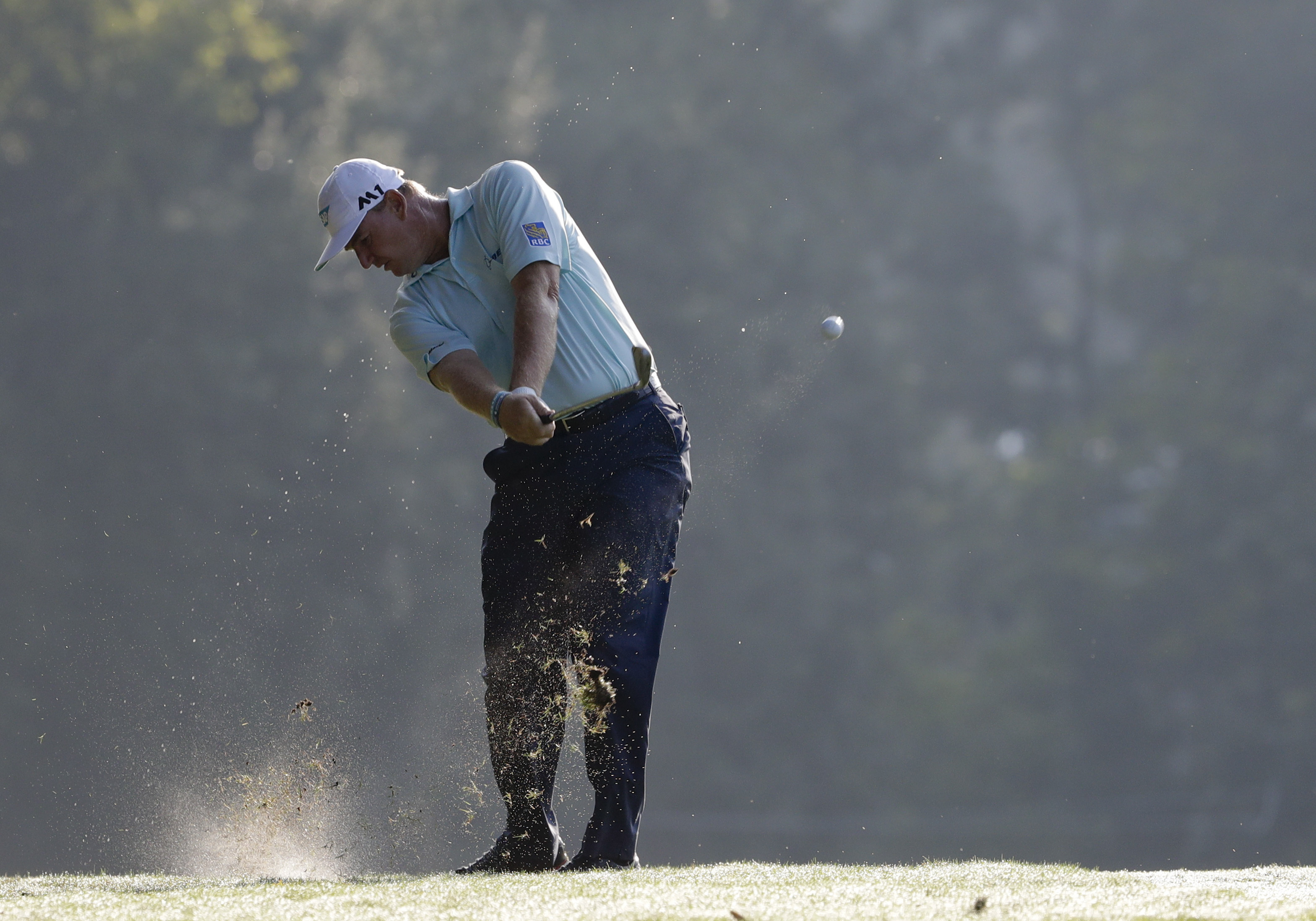 The Latest: Kisner joins Olesen in share of the lead at PGA