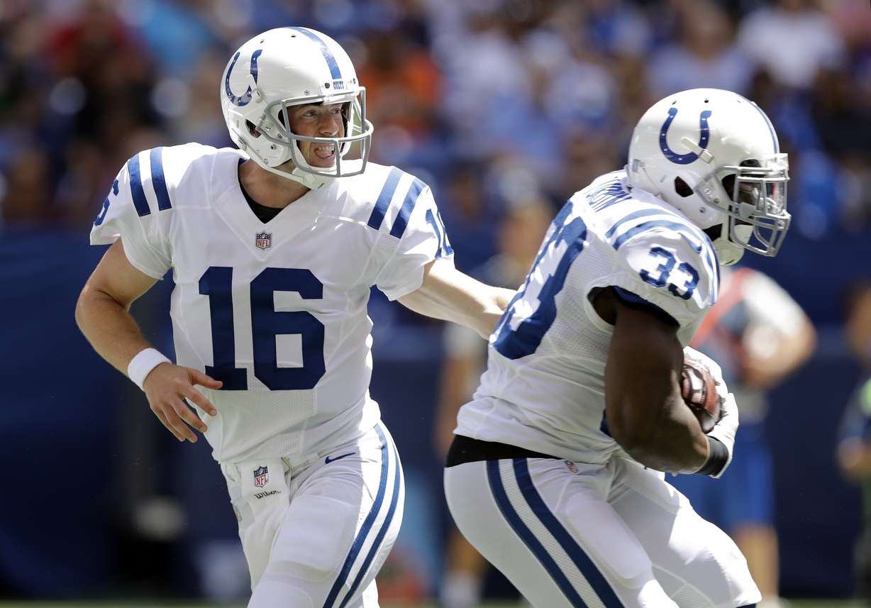 Indianapolis Colts quarterback Scott Tolzien (16) hands off to running back Robert Turbin (33) during the first half of an NFL preseason football game against the Detroit Lions, Sunday, Aug. 13, 2017, in Indianapolis.
