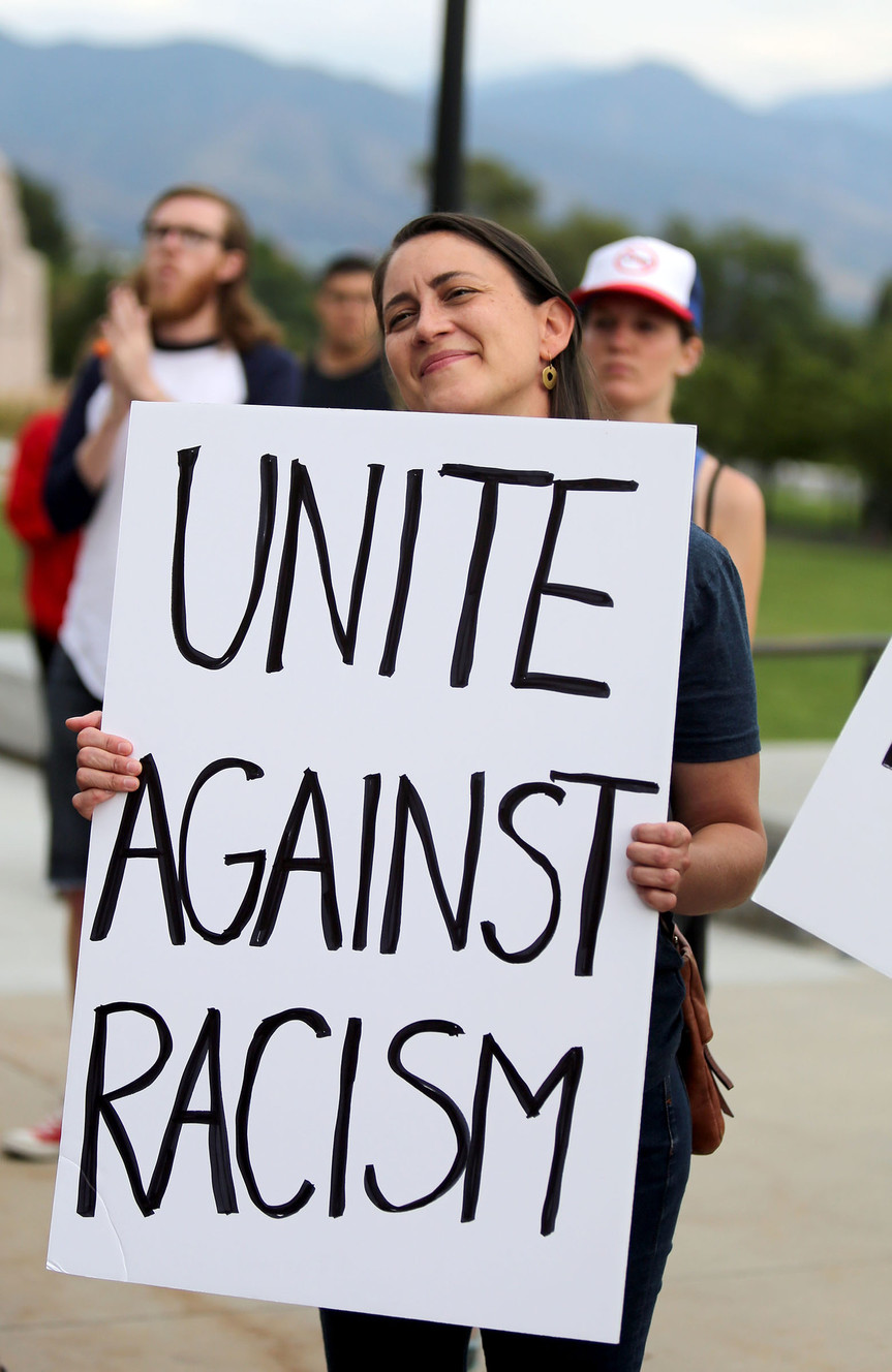 Jessica Preece holds a sign at the One Utah Rally for Unity on the steps of the state Capitol in Salt Lake City on Monday, Aug. 14, 2017. (Photo: Kristin Murphy, Deseret News)