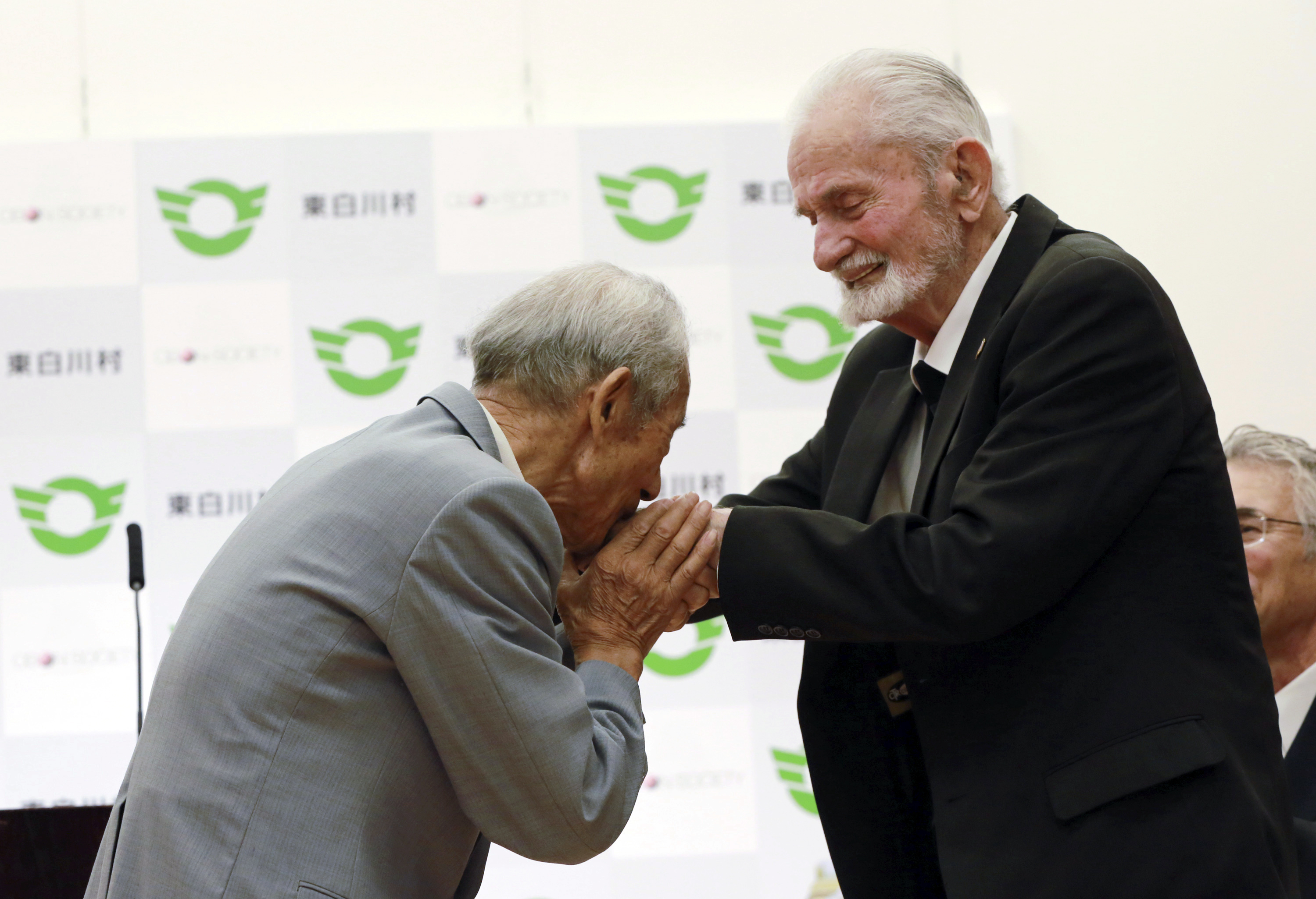 The Latest: US WWII vet says he, Japan family can move on