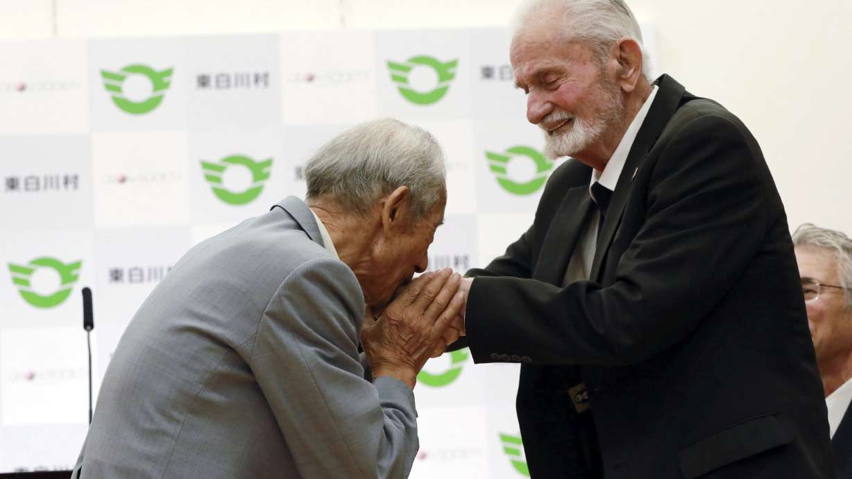The Latest: US WWII vet says he, Japan family can move on