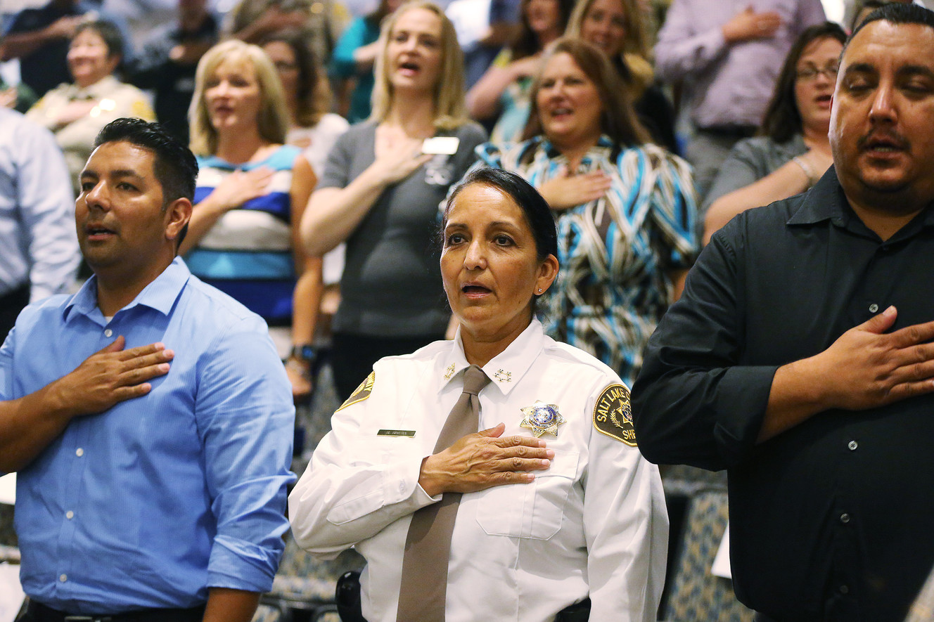 Unified Police Deputy Chief Rosie Rivera and others stand for the Pledge of Allegiance prior to Rivera being sworn in as Salt Lake County sheriff during a ceremony in Salt Lake City on Tuesday, Aug. 15, 2017. (Photo: Jeffrey D. Allred, Deseret News)