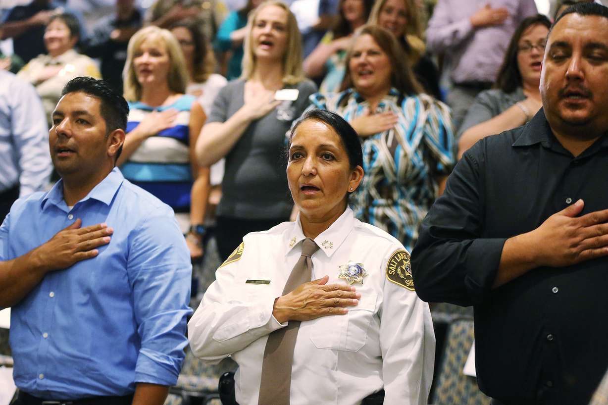 Unified Police Deputy Chief Rosie Rivera and others stand for the Pledge of Allegiance prior to Rivera being sworn in as Salt Lake County sheriff during a ceremony in Salt Lake City on Tuesday, Aug. 15, 2017. (Photo: Jeffrey D. Allred, Deseret News)