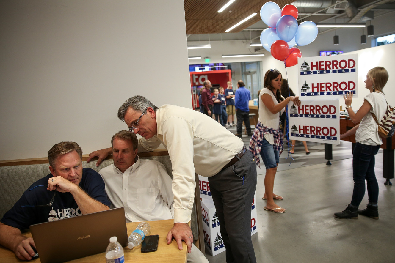 Chris Herrod, second from left, looks at election results with campaign managers Craig Frank, left, and Ken Sumsion, third from left, at a party to watch results in the Republican primary election for the 3rd Congressional District seat at the Entrata headquarters in Lehi on Tuesday, Aug. 15, 2017. (Photo: Spenser Heaps, Deseret News)