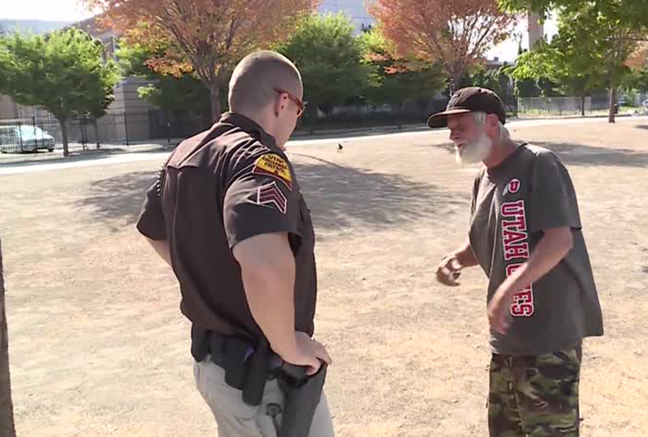 UHP trooper talks with a man in the Rio Grande area Tuesday, Aug. 15, 2017. Photo: KSL TV