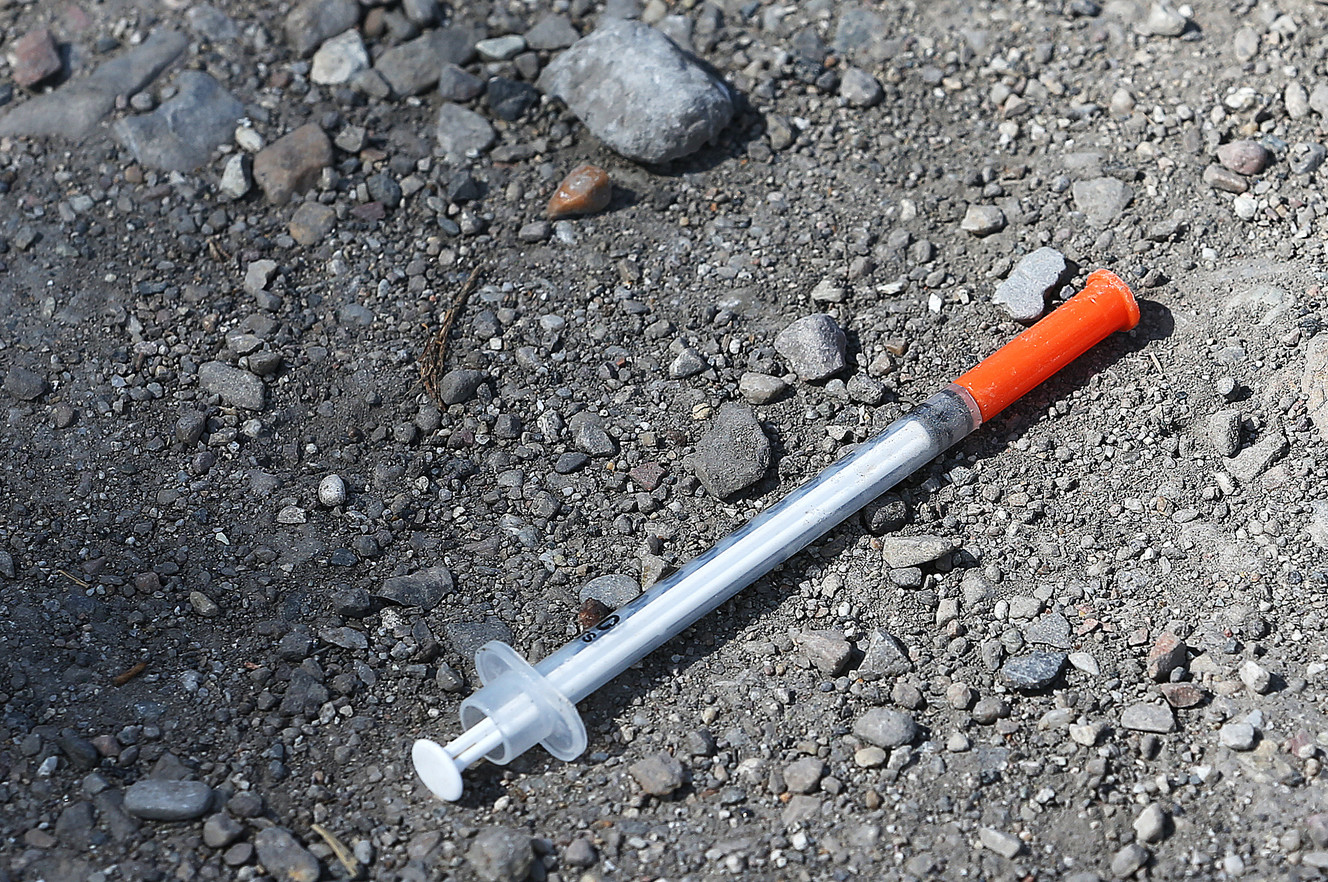 A syringe lays on the ground near the Rio Grande depot as the large police presence in the area has forced many of the homeless out in Salt Lake City on Wednesday, Aug. 16, 2017. (Photo: Scott G Winterton, Deseret News)