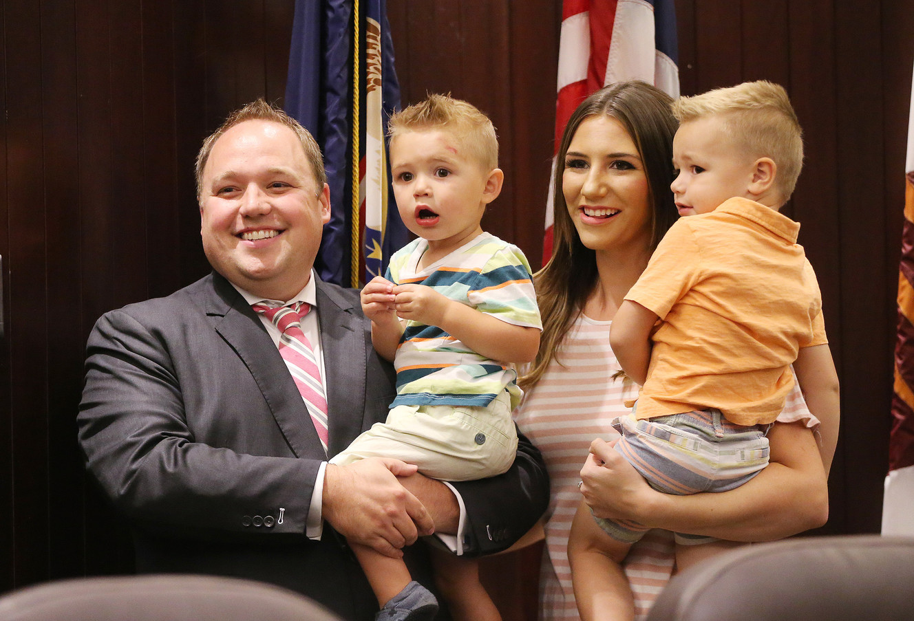 Adam Gardiner, wife Katie and sons Mason and Jaxon pose for a photo after he was sworn in as the new Salt Lake County recorder during a special meeting of the County Council in Salt Lake City on Friday, Aug. 18, 2017. (Photo: Jeffrey D. Allred, Deseret News)