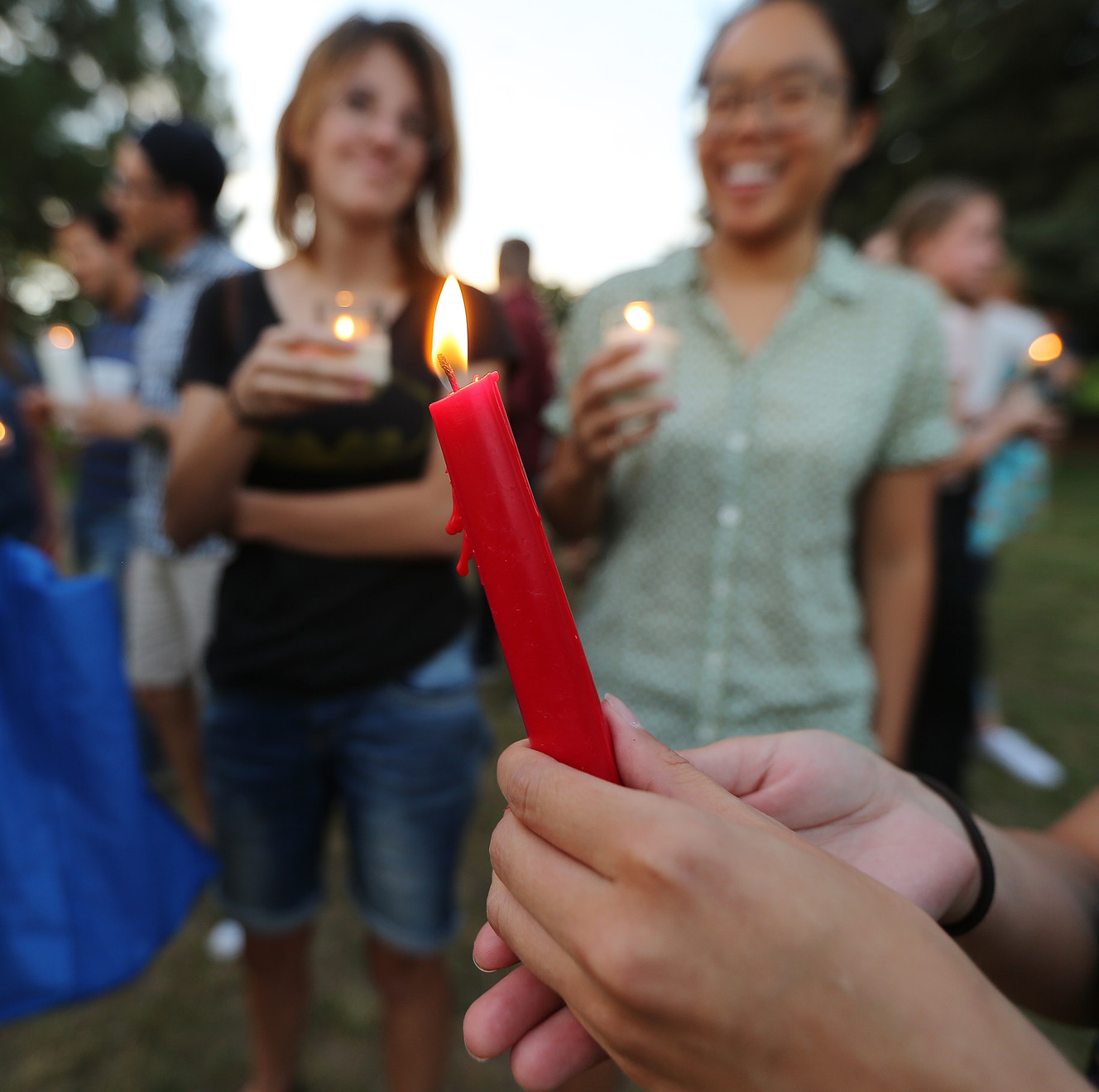Students and community members hold candles as they attend a solidarity vigil to stand against white supremacy and racism hosted by BYU college Republican and Democrat clubs in Provo on Sunday, Aug. 20, 2017. (Photo: Scott G Winterton, Deseret News)