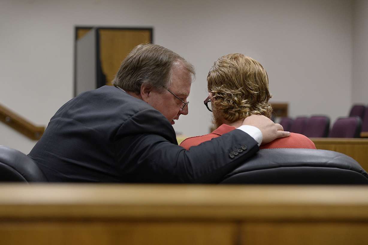 Defense attorney Neil Skousen speaks with his client, Joe Przybycien, 18, of Spanish Fork, during an evidence hearing in Provo's 4th District Court on Wednesday, Aug. 23, 2017. Przybycien is charged with murder, a first-degree felony, in the death of 16-year-old Jchandra Brown, who was found hanging from a rope near Maple Lake in Payson on May 6. Prosecutors say Przybycien helped Brown prepare to kill herself, then recorded her for 10 to 11 minutes on a cellphone while she did, never trying to help the girl. (Photo: Scott Sommerdorf)