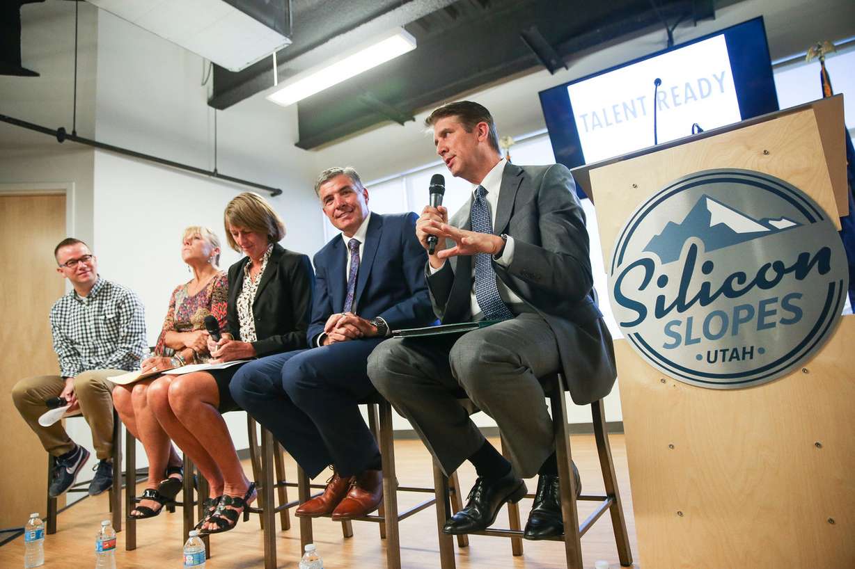 Matthew S. Holland, right, president of Utah Valley University, speaks on a panel at the Silicon Slopes headquarters in Lehi on Wednesday, Aug. 23, 2017. Also on the panel are Clint Betts, of Silicon Slopes, Deneece G. Huftalin, president of Salt Lake Community College, Noelle Cockett, president of Utah State University, and Dave Woolstenhulme, commissioner of the Utah System of Technical Education, left to right. (Photo: Spenser Heaps, Deseret News)
