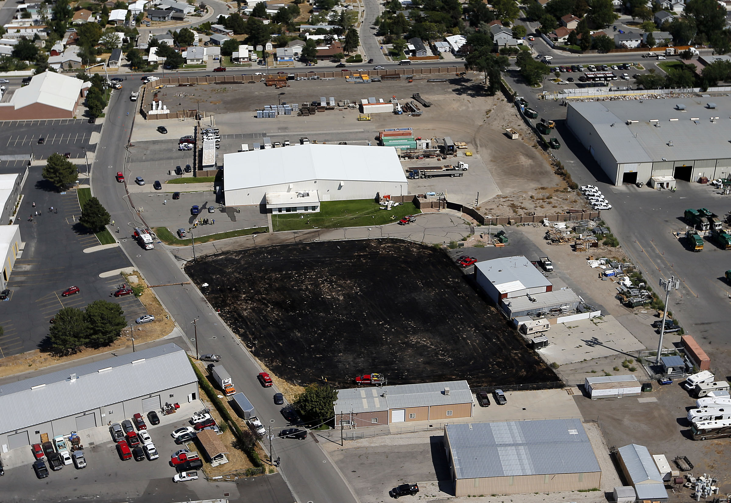 A field burned by a grass fire sparked after plane crashed in West Jordan Thursday afternoon (Photo: Ravell Call, Deseret News)