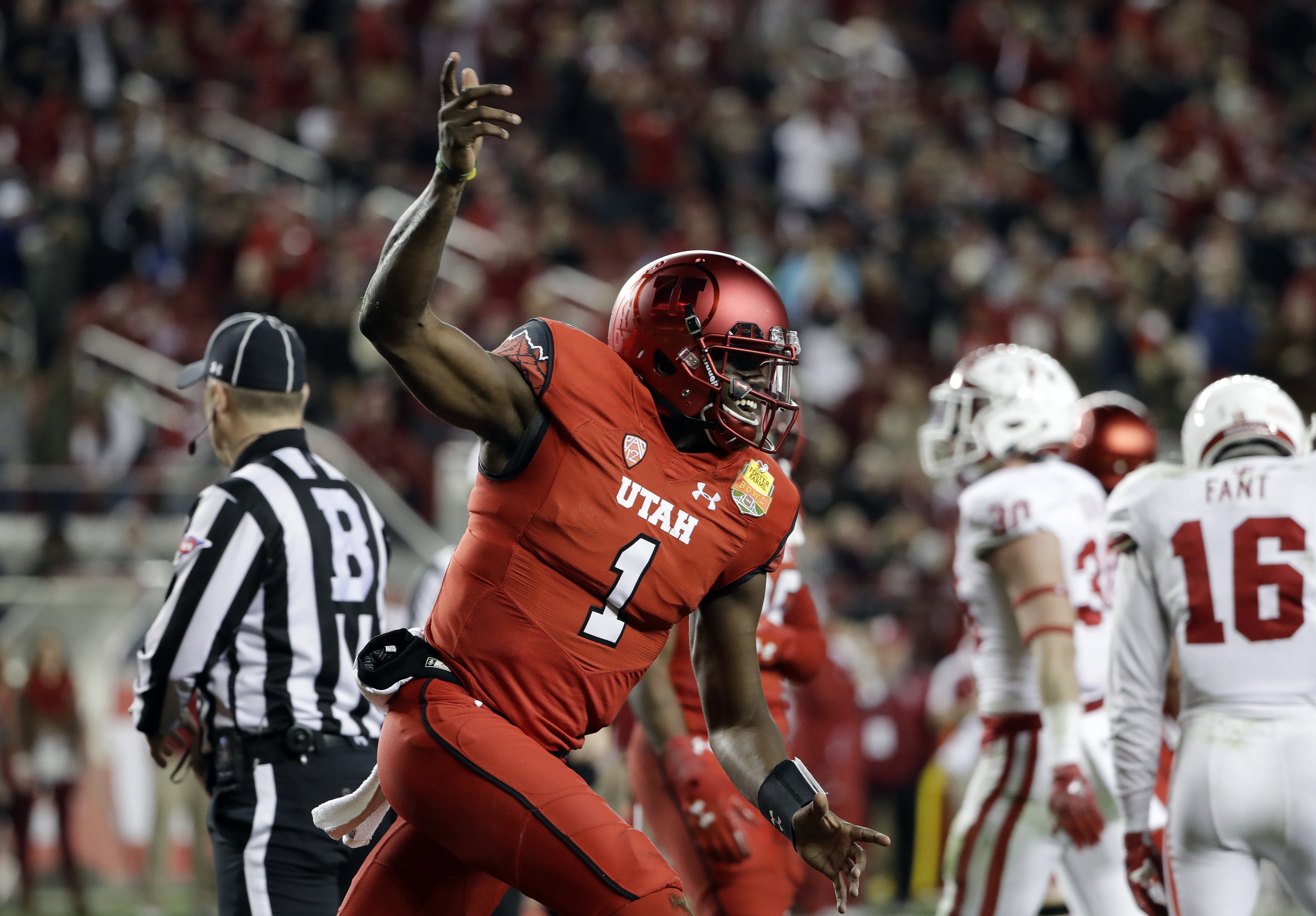 Utah quarterback Tyler Huntley (1) celebrates after scoring on a rushing touchdown against Indiana during the first half of the Foster Farms Bowl NCAA college football game Wednesday, Dec. 28, 2016, in Santa Clara, Calif. (Photo: Marcio Jose Sanchez, AP Photo)