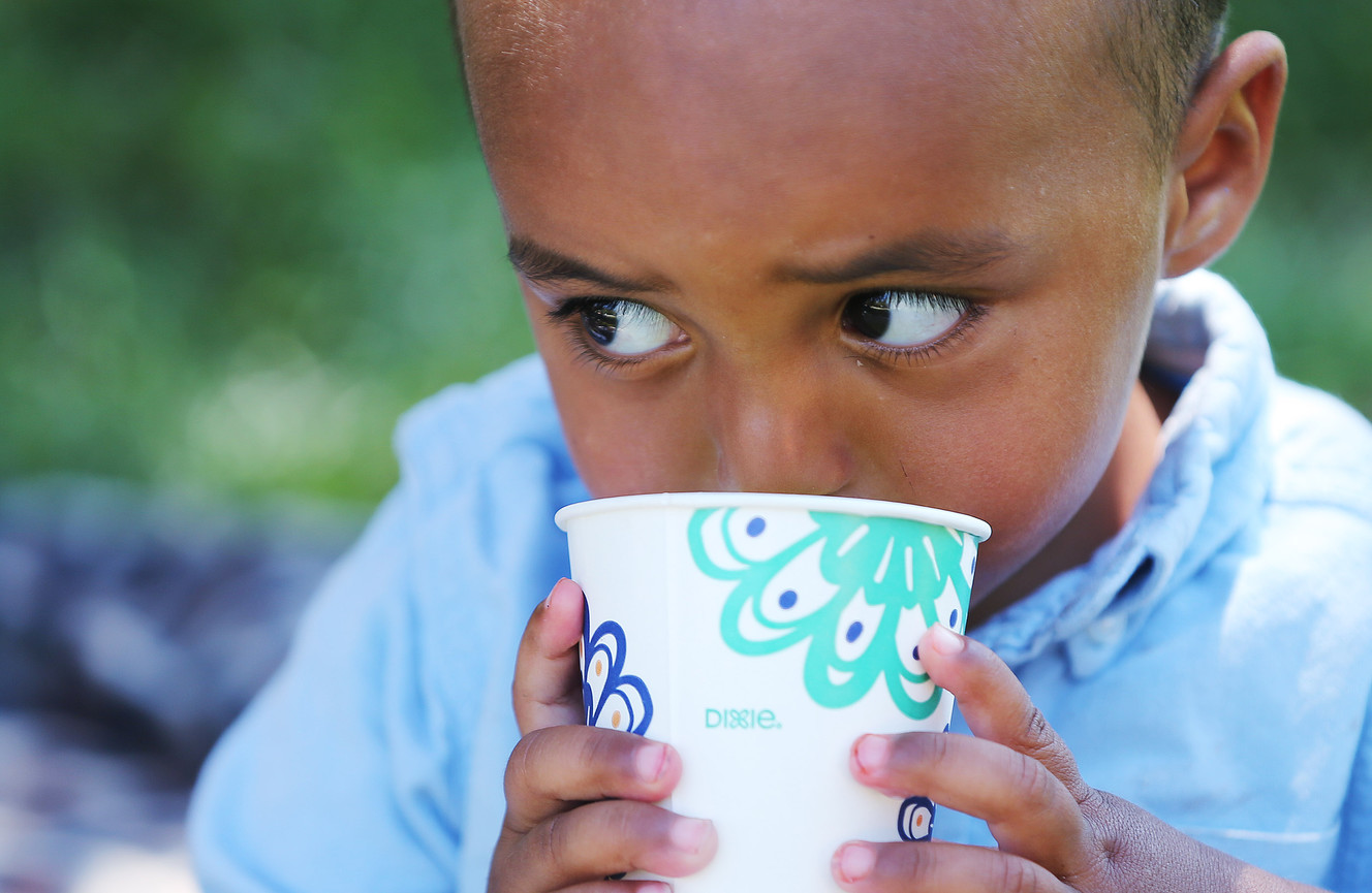 Elijah Obdullanhi takes a drink as homeless residents are treated to a picnic lunch in Pioneer Park in Salt Lake City on Sunday, Aug. 27, 2017. Participants also received a new blanket and listened to live music. (Photo: Jeffrey D. Allred, Deseret News)