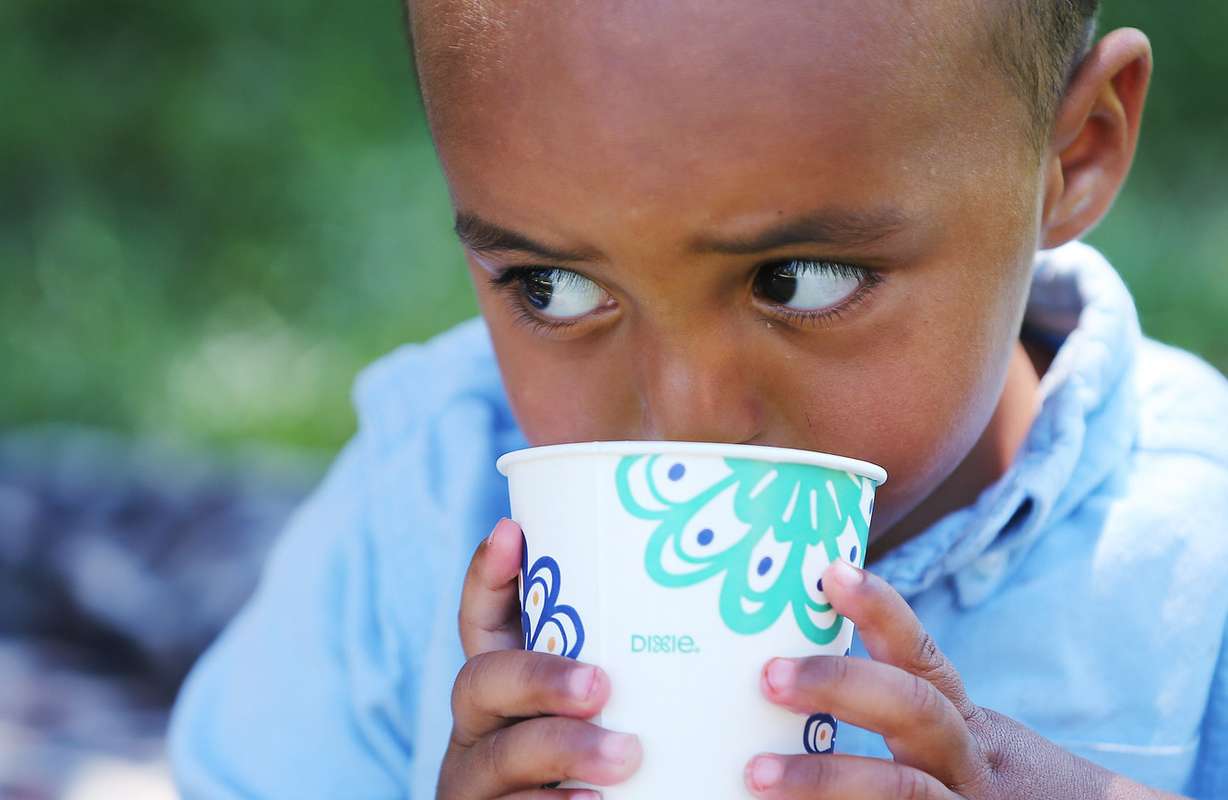 Elijah Obdullanhi takes a drink as homeless residents are treated to a picnic lunch in Pioneer Park in Salt Lake City on Sunday, Aug. 27, 2017. Participants also received a new blanket and listened to live music. (Photo: Jeffrey D. Allred, Deseret News)