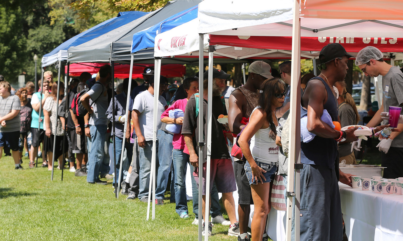 Food is served as homeless residents are treated to a picnic lunch in Pioneer Park in Salt Lake City on Sunday, Aug. 27, 2017. Participants also received a new blanket and listened to live music. (Photo: Jeffrey D. Allred, Deseret News)