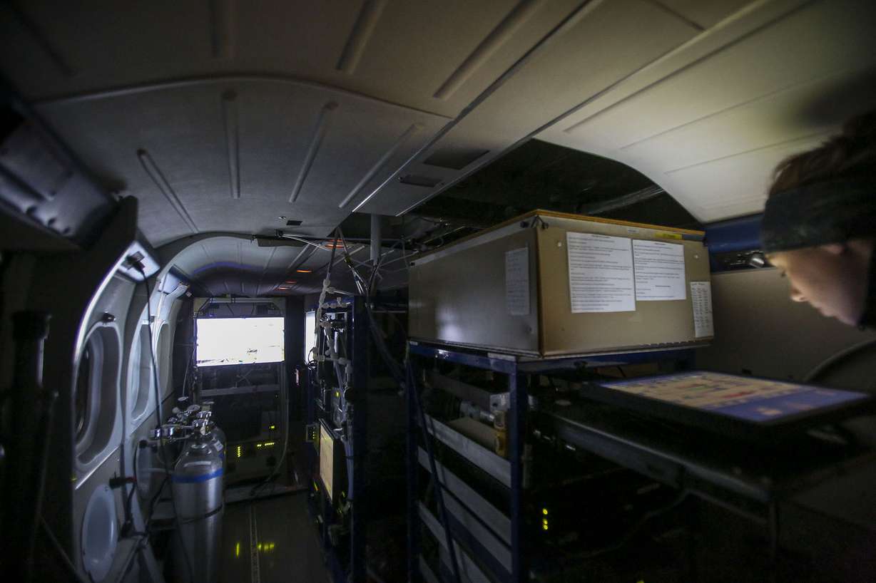 Erin McDuffie, graduate student at University Colorado, Boulder checks her instruments on the Twin Otter DHC-6 before taking off from the Salt Lake City International Airport in Salt Lake City on Sunday, Feb. 12, 2017. (Photo: Nicole Boliaux, Deseret News)
