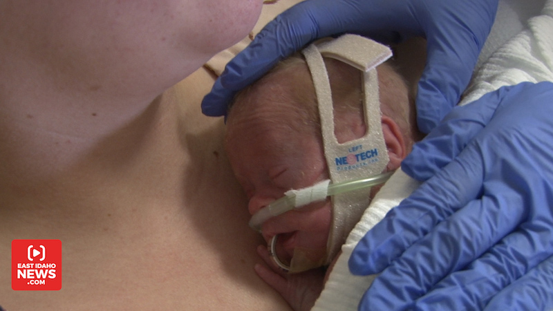 Kaio rests on his mother’s chest. (Photo: Nate Eaton, EastIdahoNews.com)