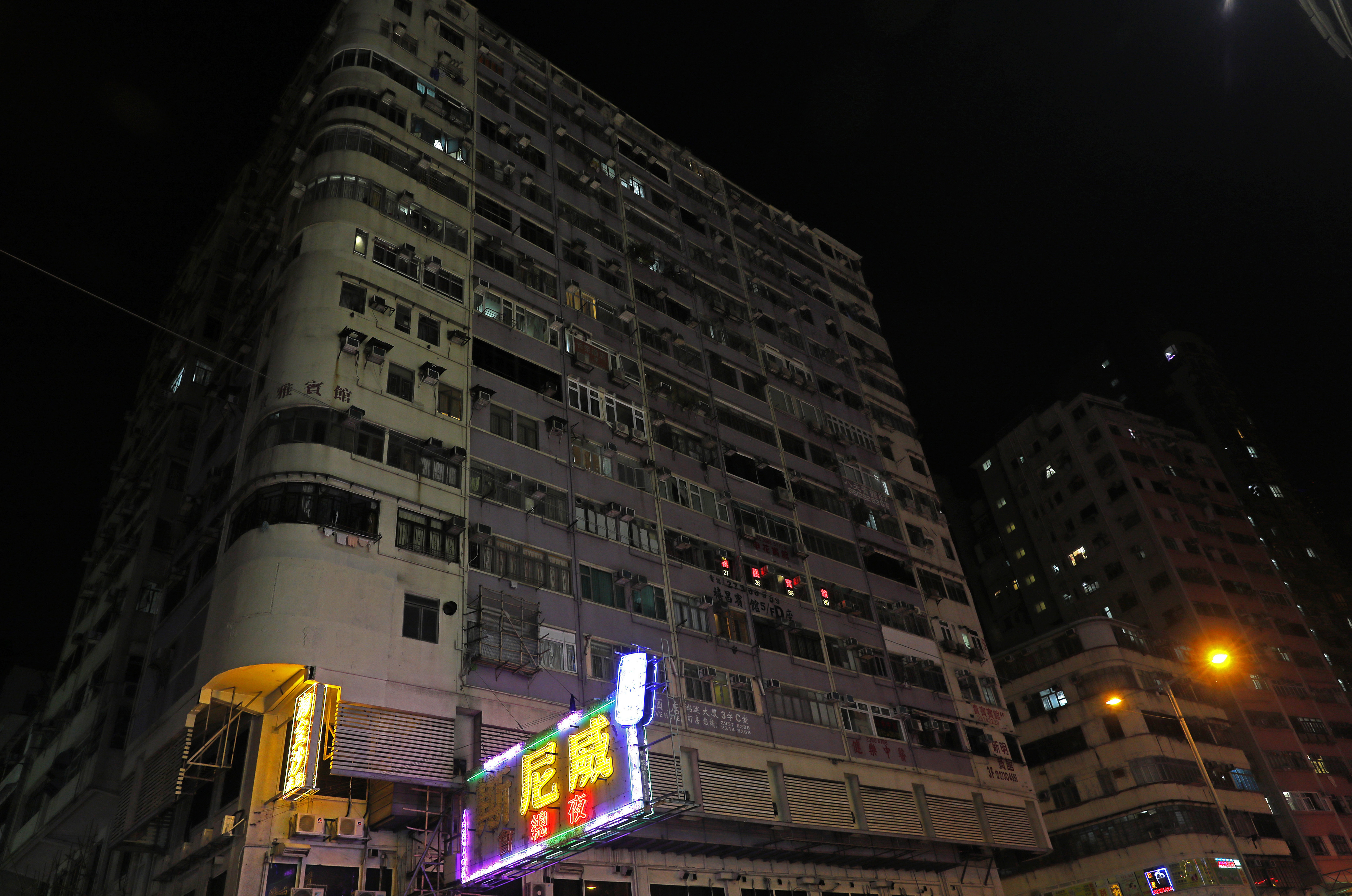 New rules, tech are dimming Hong Kong's signature neon glow