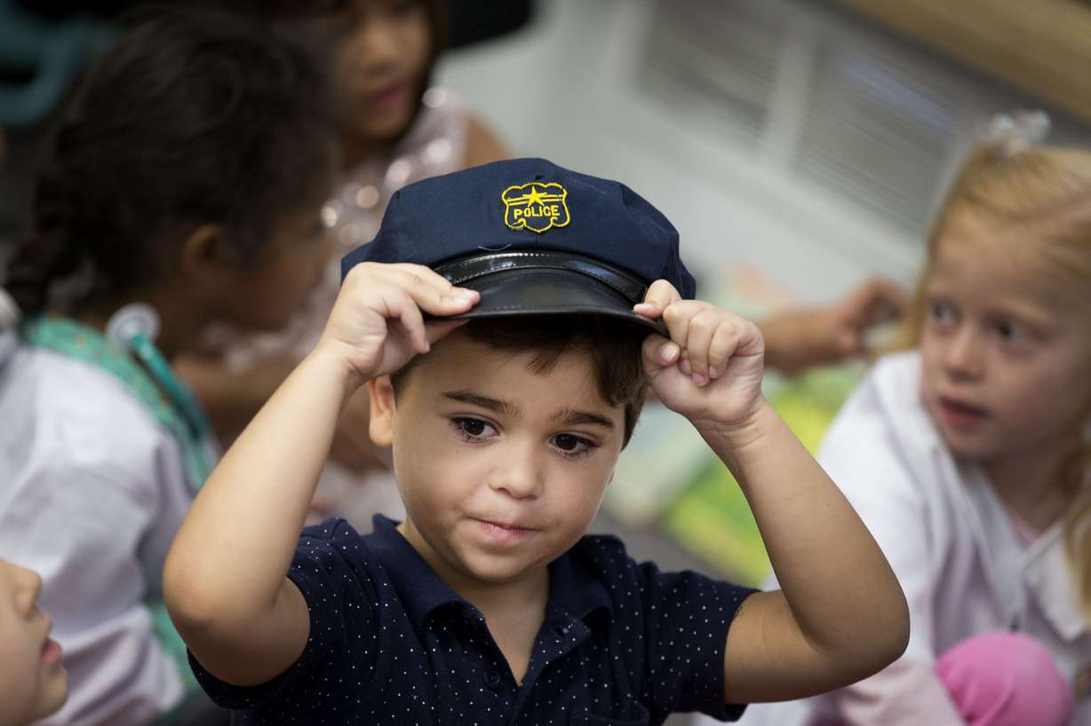 Daniel Fiuza wears a police officer's cap for Kindergarten College-Ready Day at Midvalley Elementary in Midvale on Thursday, Aug. 31, 2017. (Photo: Laura Seitz, Deseret News)