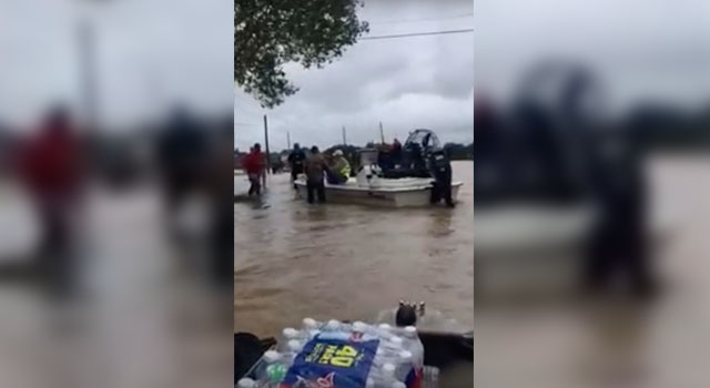 Volunteer rescue boats transport people and supplies in the flooded streets of Houston, Texas after Hurricane Harvey. (Photo: Taylor Hendershot)