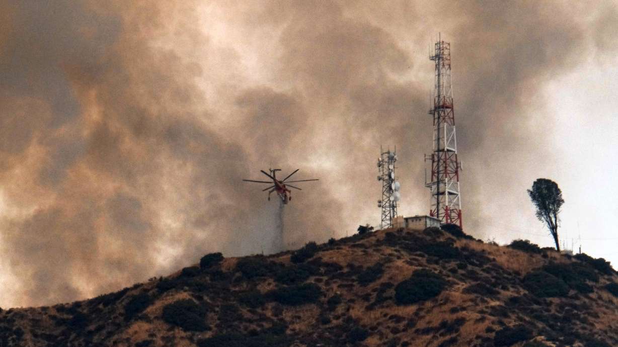 The Latest: California wildfire reaches giant sequoia grove