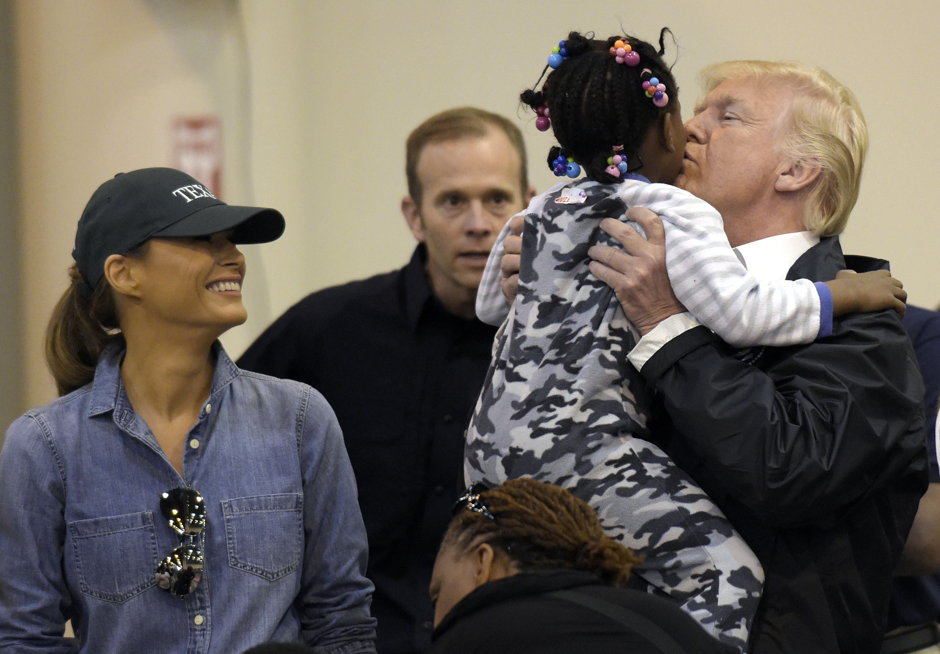 Enthusiastic Trump meets with storm victims