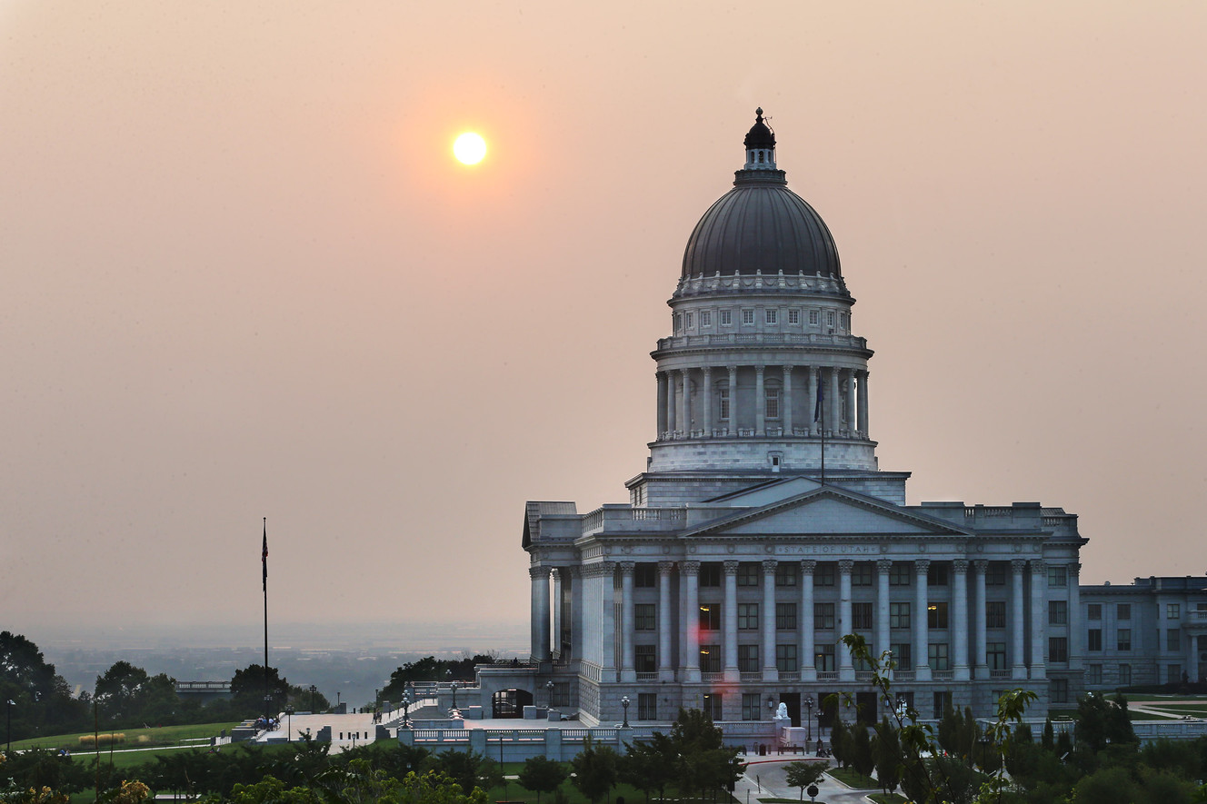 The sun sets behind the state Capitol as smoke engulfs the Wasatch Front on Wednesday, Sept. 6, 2017, as the Western states endure an active fire season. (Photo: Scott G Winterton, Deseret News)