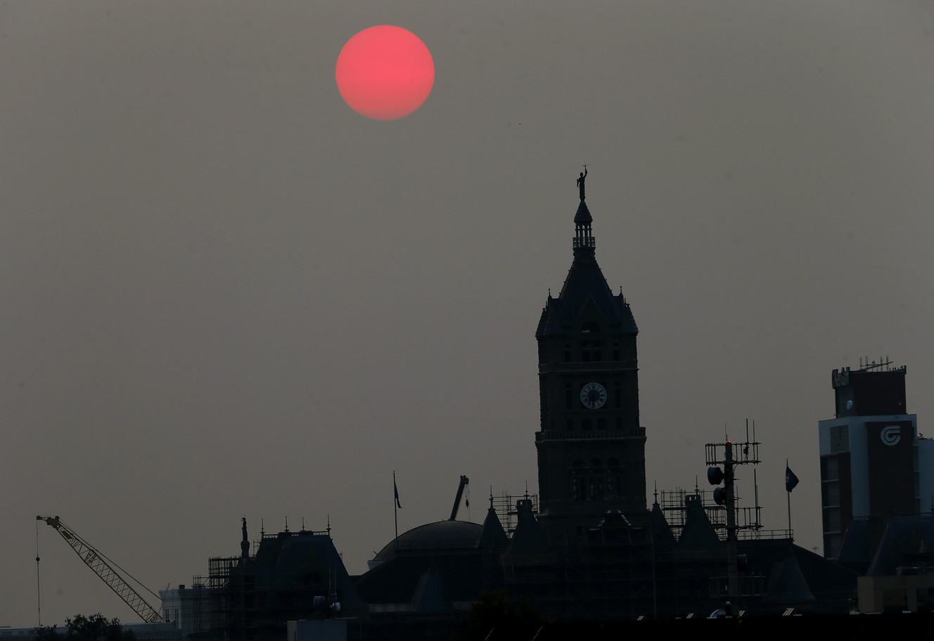 The sun sets with the City and County building in the foreground as smoke engulfs the Wasatch Front on Wednesday, Sept. 6, 2017. (Photo: Scott G Winterton, Deseret News)