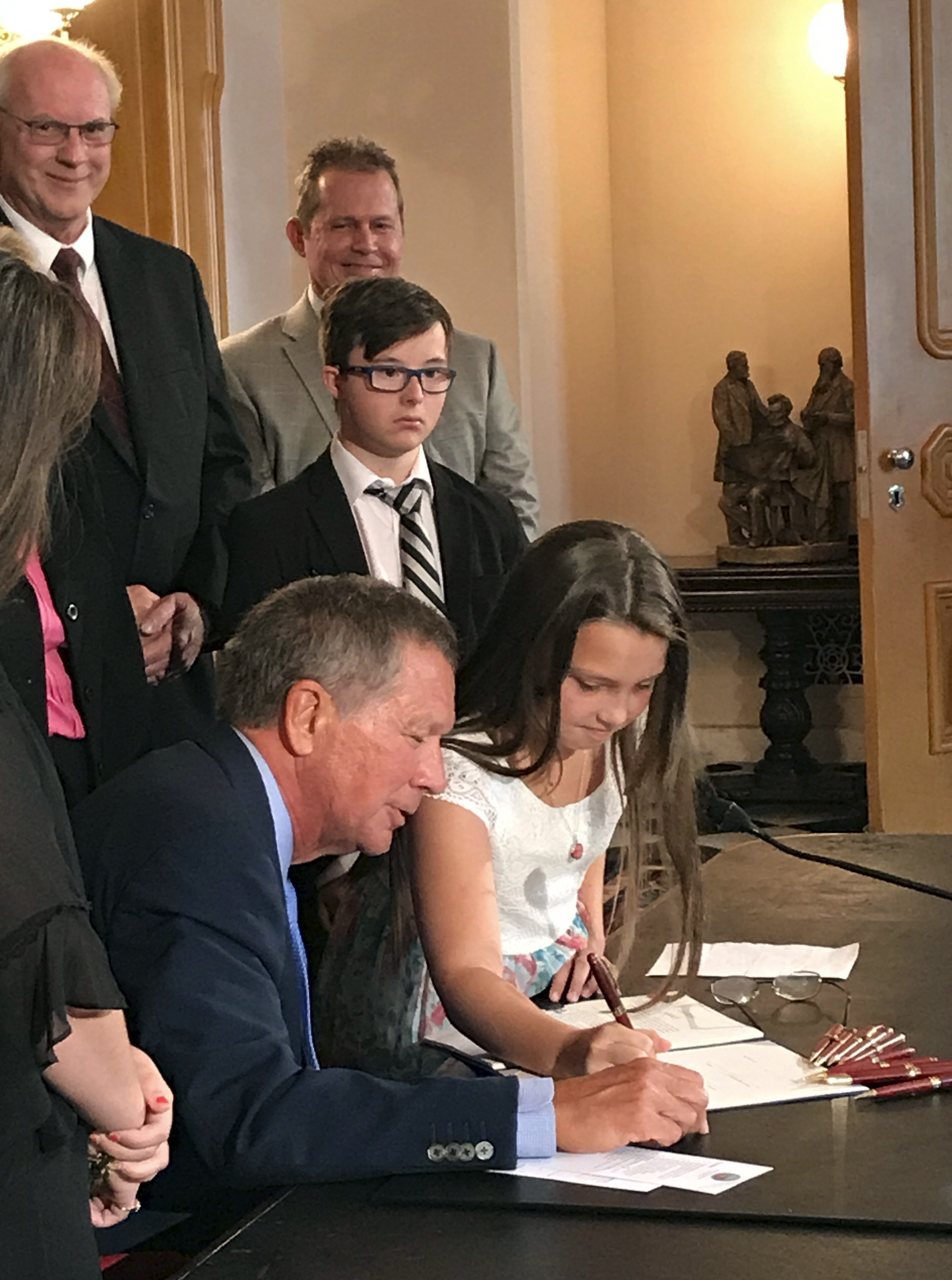 Daughters help sign 'Judy's Law' for woman set ablaze by ex