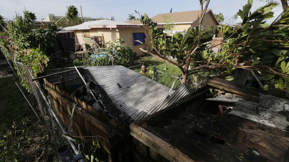 Irma's roar gives way to grinding chorus of saws, generators