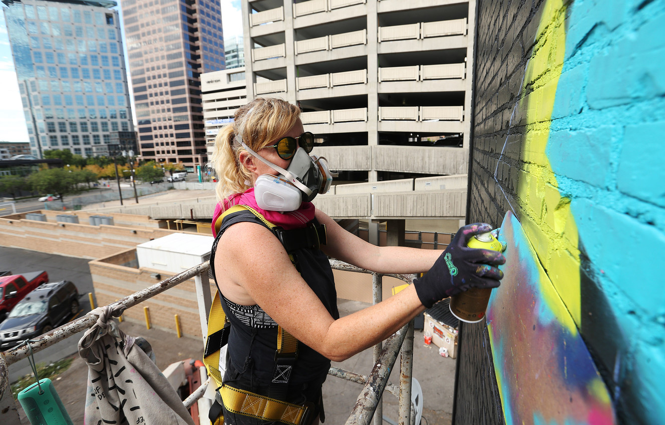 Street artist Vexta works on a five-story tall, 150-foot-long mural in downtown Salt Lake City on Wednesday, Sept. 13, 2017. Utah based 3 Irons commissioned work. (Photo: Jeffrey D. Allred, KSL)