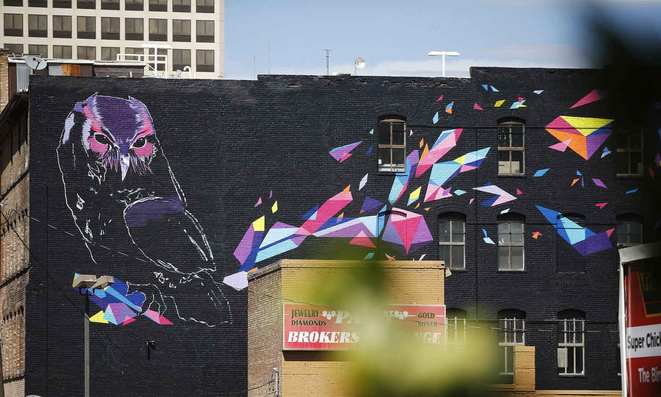World-renowned street artist adds colorful mural to downtown S.L.