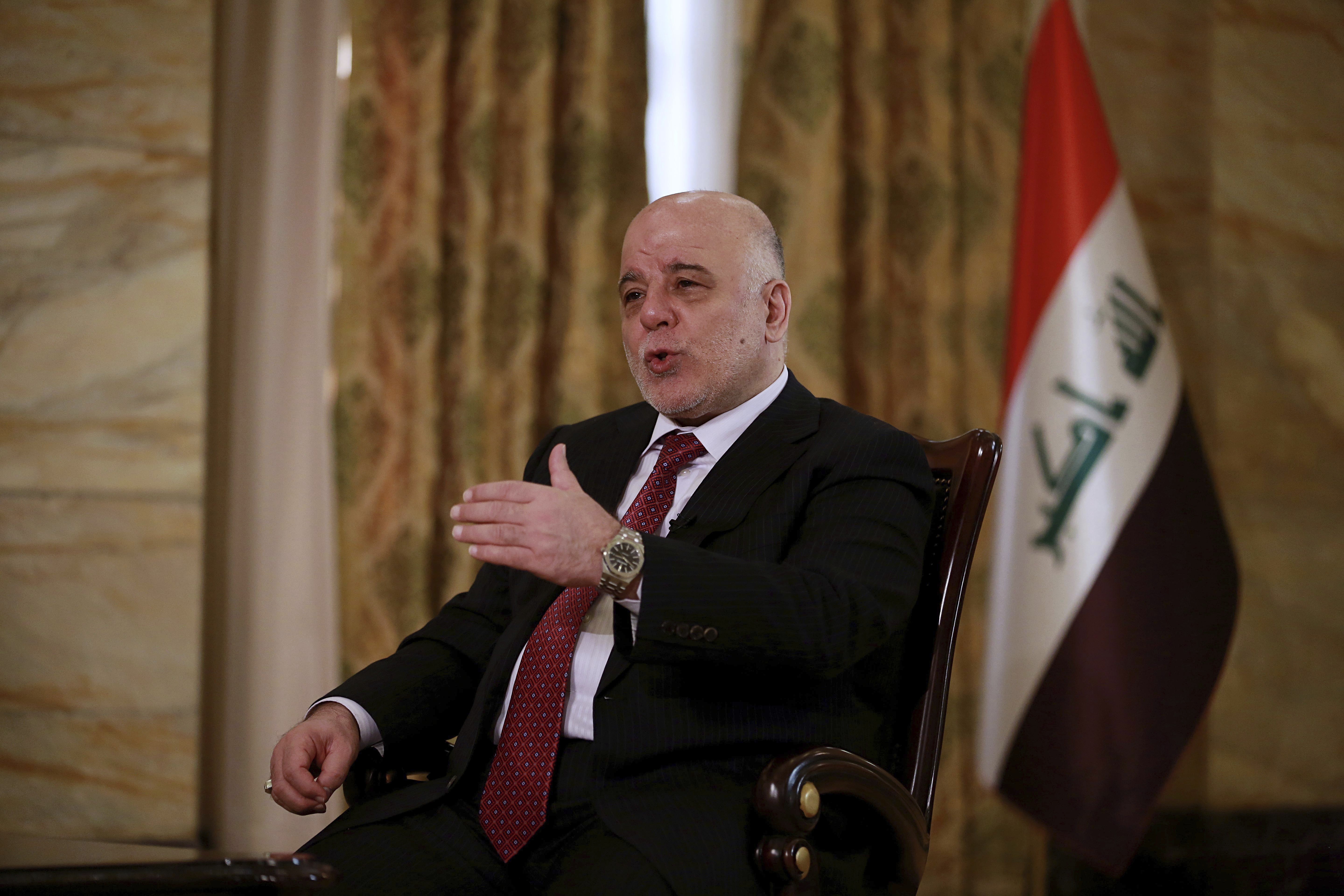 The Latest: Iraq PM says Mosul abuses not systematic