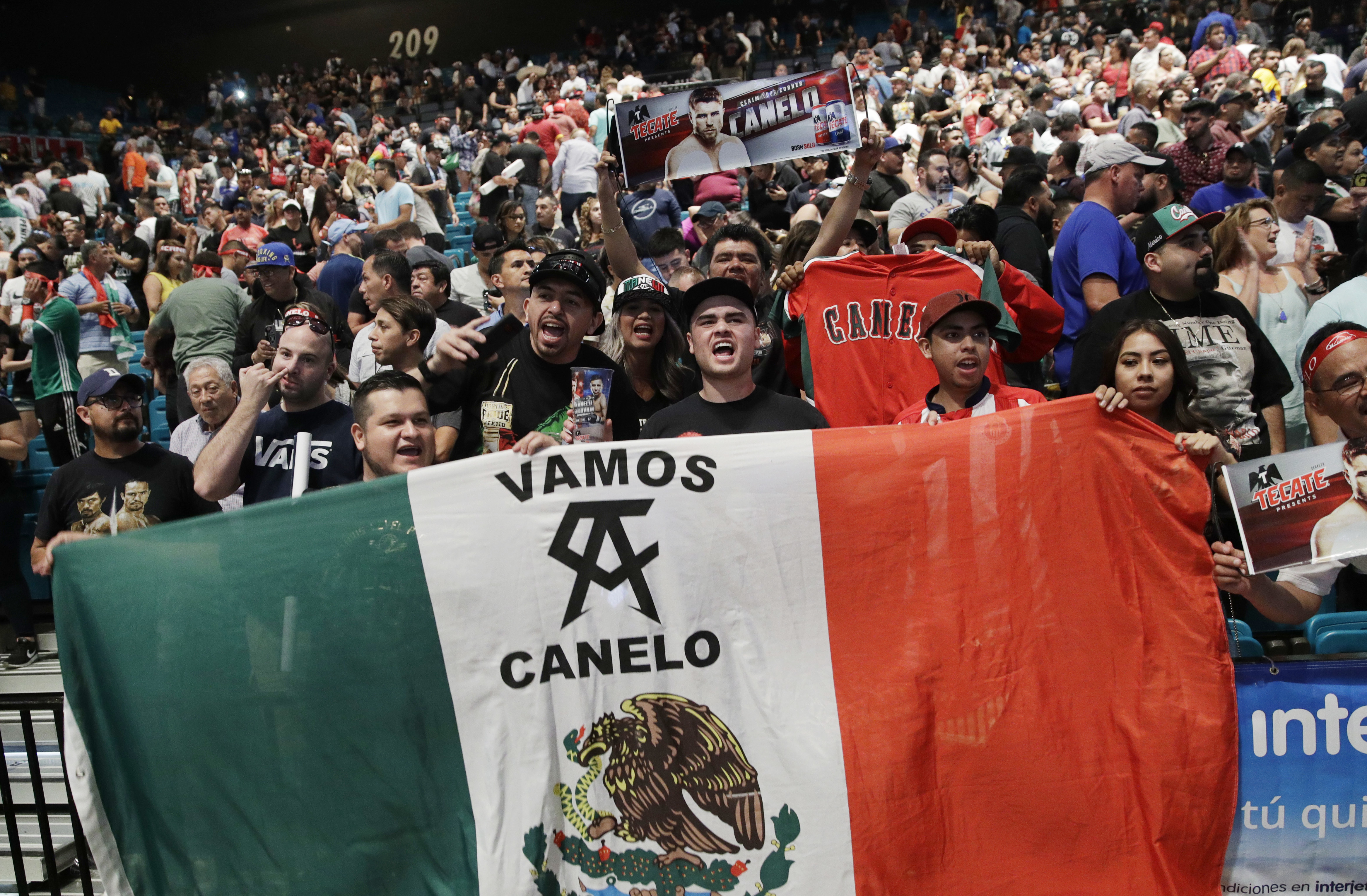 The Latest: Alvarez and Golovkin fight to brutal draw