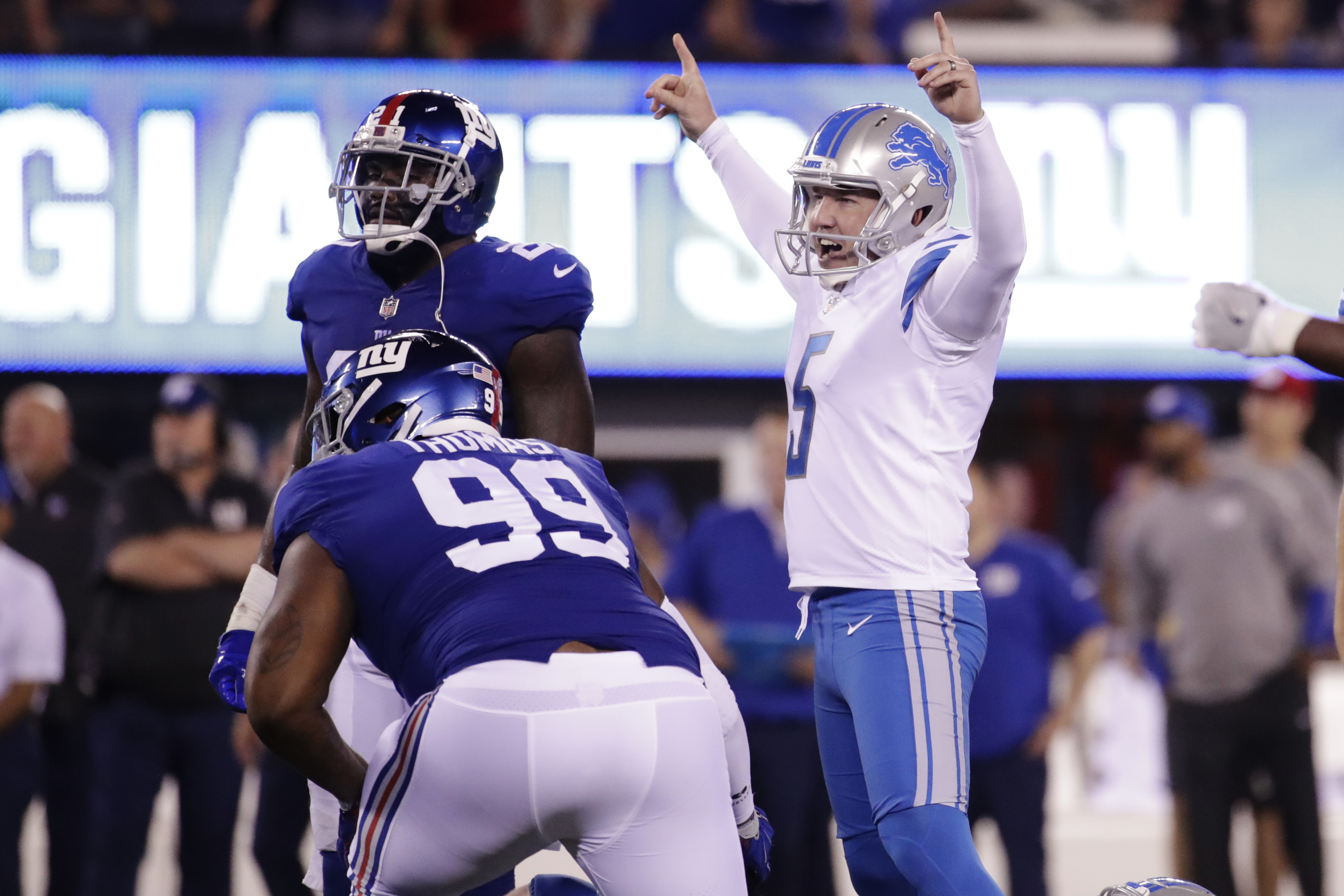 Stafford throws for 2 TDs as Lions beat Beckham, Giants