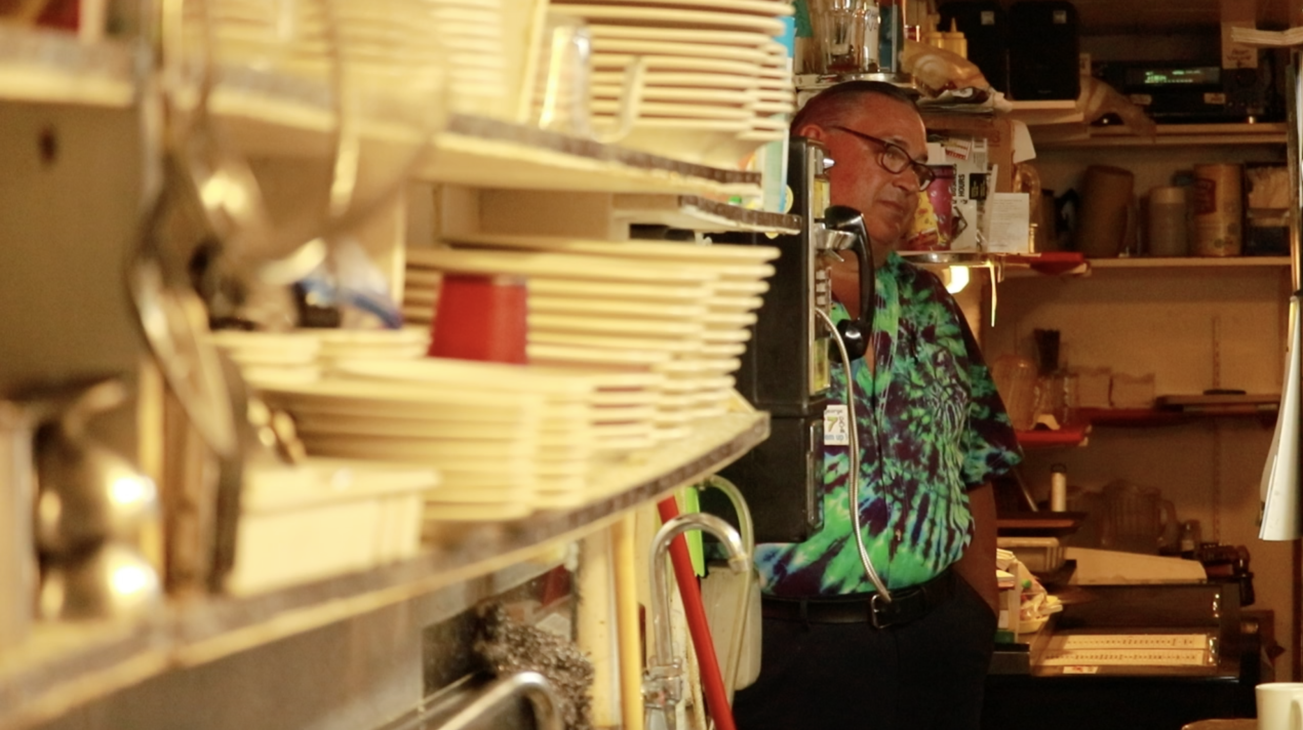 Crazy George watches his mother cook. Photo: Liesl Nielsen