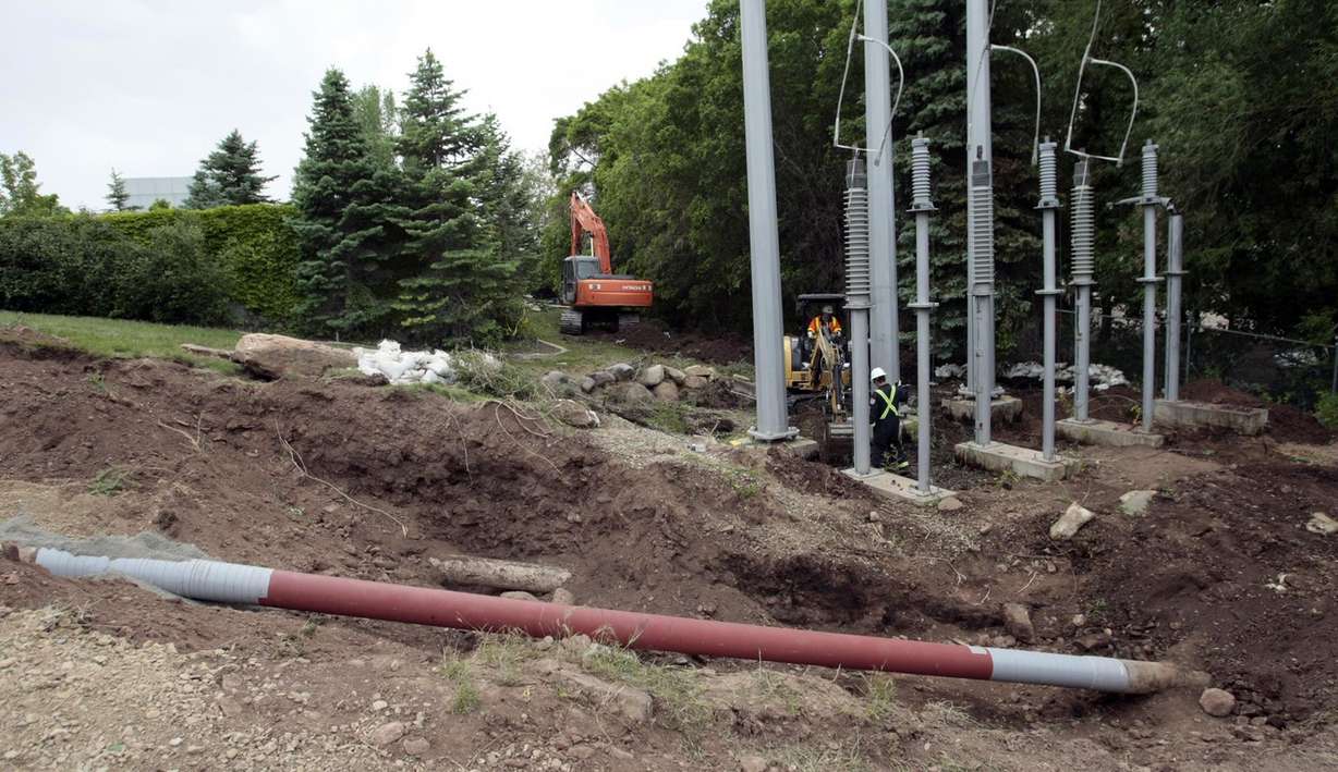 With the repaired section of pipeline in the foreground, crews work on Wednesday, June 16, 2010, to clean up the site near Red Butte Garden in Salt Lake City following an oil spill. Photo: KSL, File