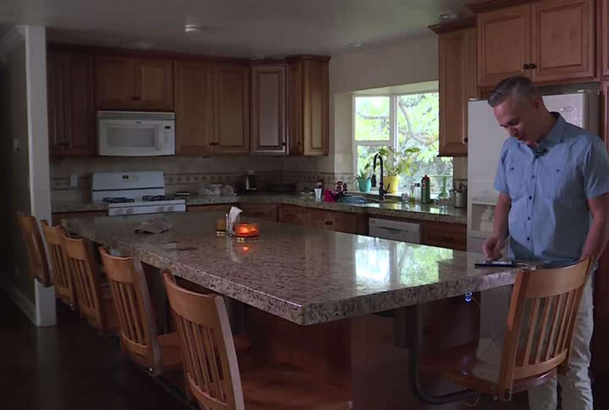 Jose Cruz of Provo listens to a radio live stream from Puerto Rico for news. Photo: Stuart Johnson, KSL TV