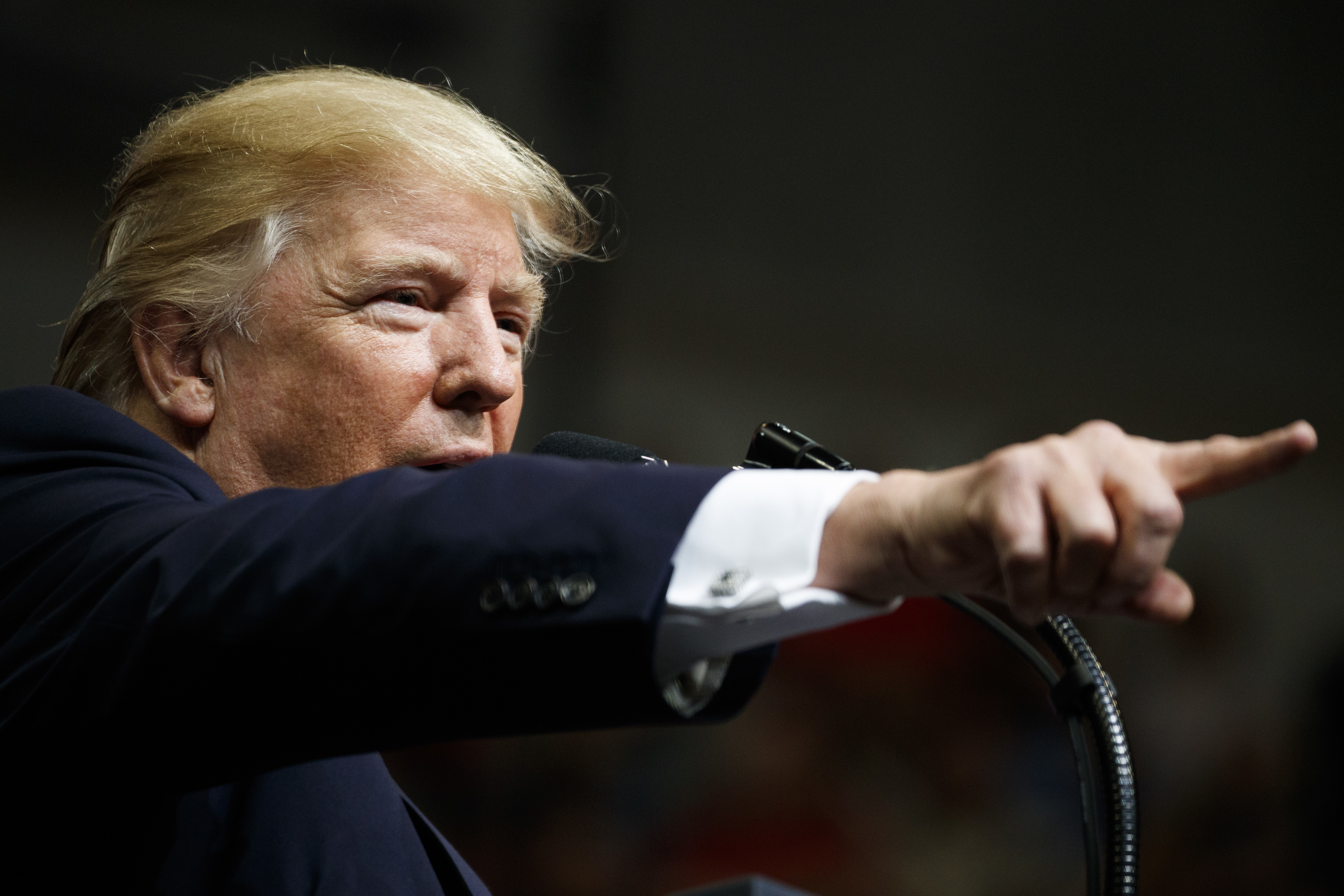 Trump says he's putting political neck on line in Ala. race