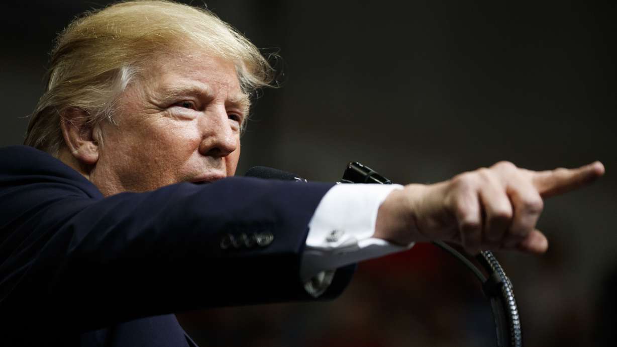 Trump says he's putting political neck on line in Ala. race