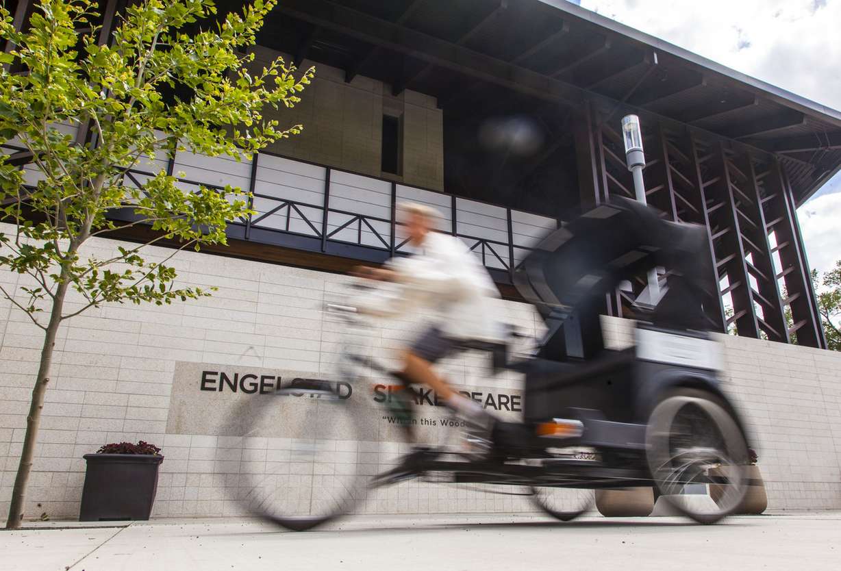 Caleb Nelson, owner of Romeo's Rickshaws, rides one of his pedicabs at the Beverley Taylor Sorenson Center for the Arts in Cedar City on Thursday, July 27, 2017. (Photo: Jordan Allred, The Spectrum)