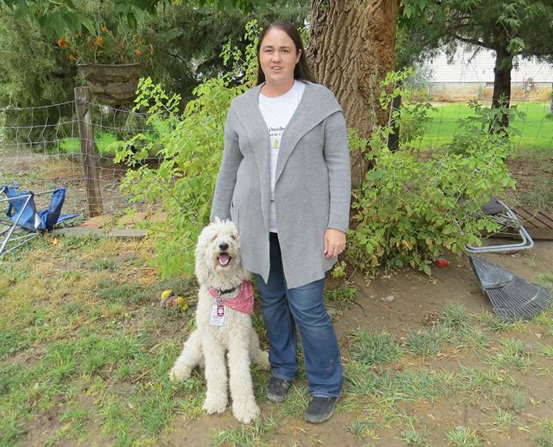 Pocatello resident Nikki Jorgenson, with her service dog, Zeus, who assists her when she has seizures. Zeus is a standard white poodle. (Photo: Courtesy Nikki Jorgenson)