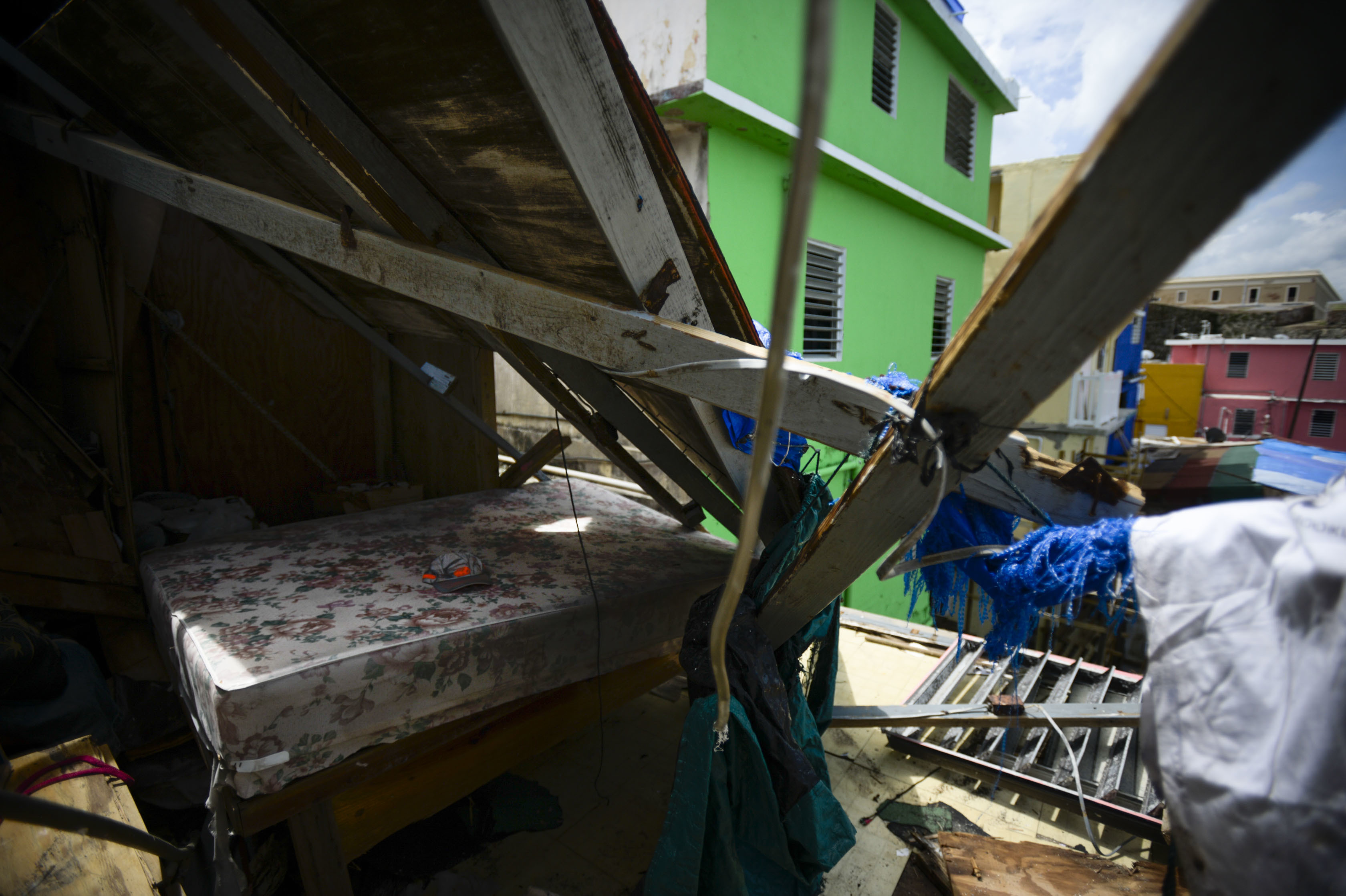 A hat rests on a bed surrounded by debris after Hurricane Maria, in San Juan, Puerto Rico, Monday, Sept. 25, 2017. The island territory of more than 3 million U.S. citizens is reeling in the devastating wake of Hurricane Maria. (AP Photo/Carlos Giusti)