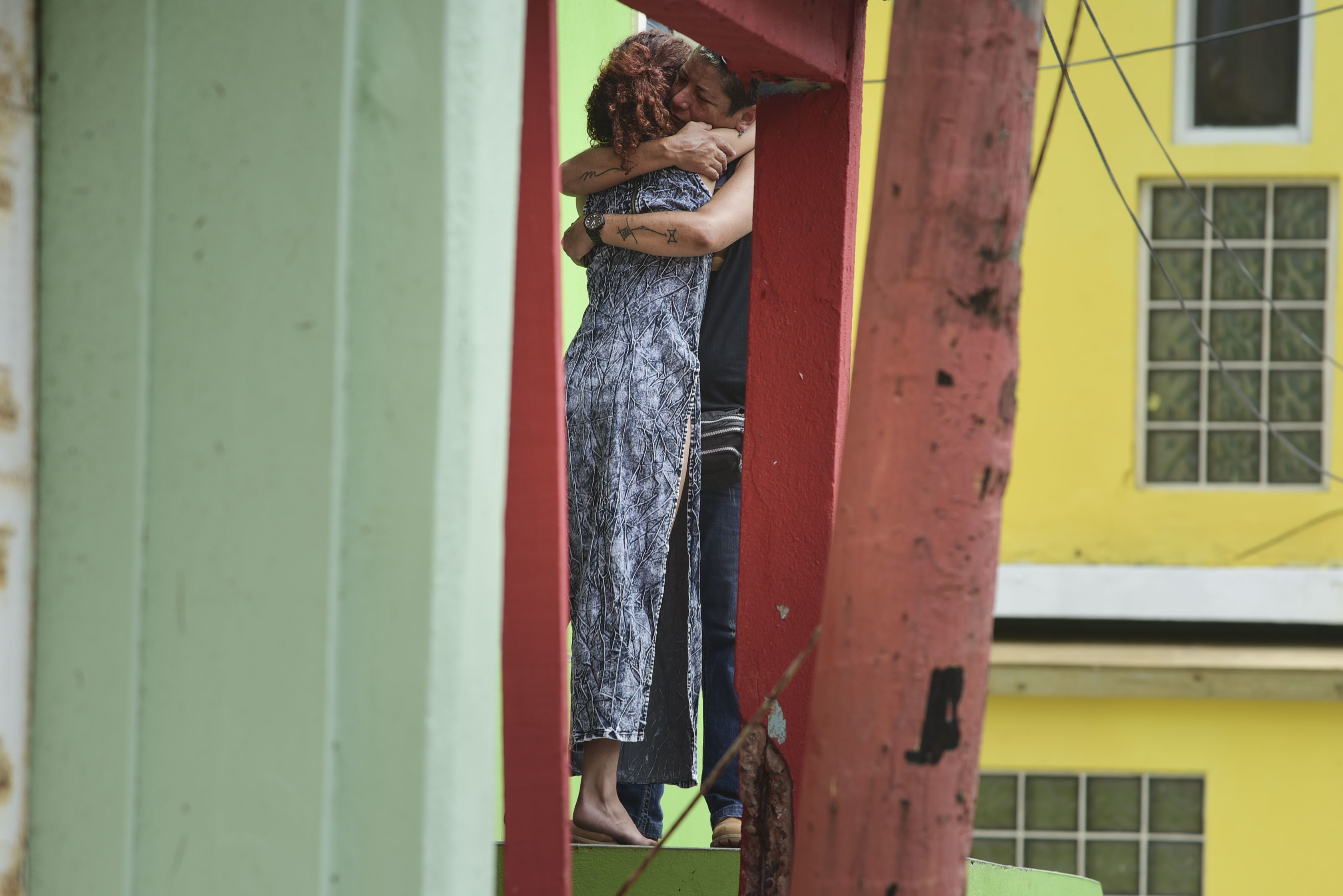Residents at La Perla community in Old San Juan comfort one another as the community recovers from Hurricane Maria, in San Juan, Puerto Rico, Monday, Sept. 25, 2017. Photo: AP Photo