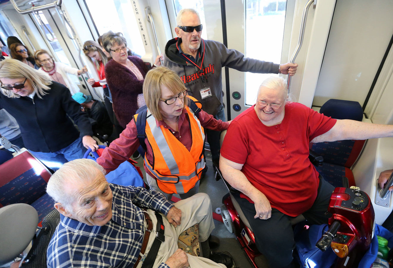 Janet Frick, center, rides TRAX with John Doyle, left, and Peggy Naud, right, to go grocery shopping as part of Salt Lake County Aging and Adult Services' Transit Together Grocery Project, made possible with funding provided by AARP, in Salt Lake City, on Tuesday, Sept. 26, 2017. (Photo: Kristin Murphy, Deseret News)