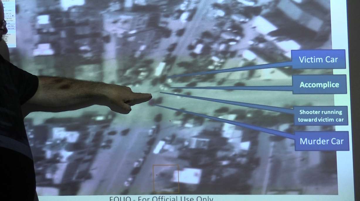 At the modest headquarters of Persistent Surveillance Systems LLC just outside Dayton, Ohio, founder Ross McNutt shows how Wide Area Persistent Surveillance can be used to solve a crime. Seconds after someone reported a murder to police in 2009, McNutt's analysts hit rewind and zoomed in on the alley. The image quality of the zoomed-in recording is relatively poor; an individual person is unrecognizable, appearing as a single-pixel on the screen. But McNutt is able to figure out what happened that day. (Photo: John Hollenhorst, Deseret News)