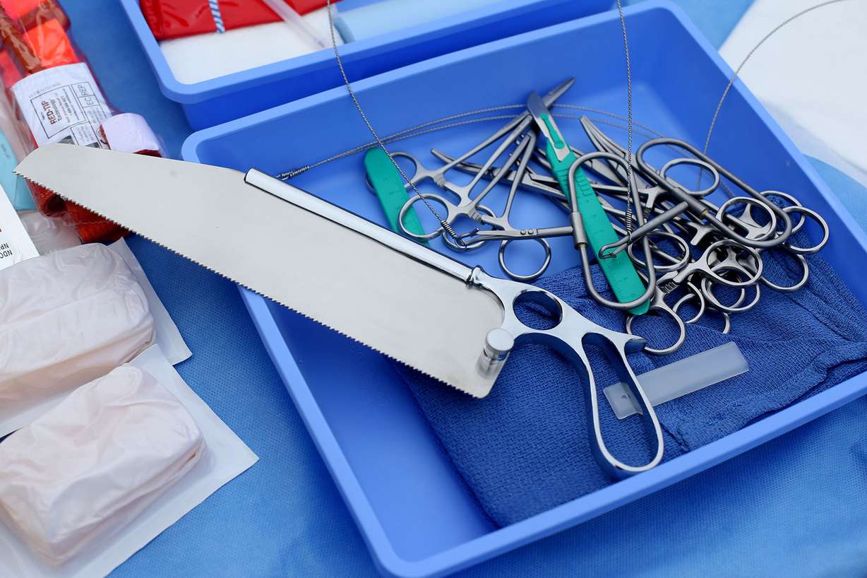Dr. Ram Nirula, trauma medical director at University of Utah Health, explains the contents of a field amputation kit during a press conference at the University Hospital's AirMed Helipad in Salt Lake City on Thursday, Sept. 28, 2017. University of Utah Health has established competency training and official guidelines regarding emergency amputations. This designation makes University of Utah Health the first Level I Trauma Center in the region with the ability to have trauma surgeons perform potentially life-saving amputations in the field for victims of traumatic injuries. (Photo: Laura Seitz, Deseret News)